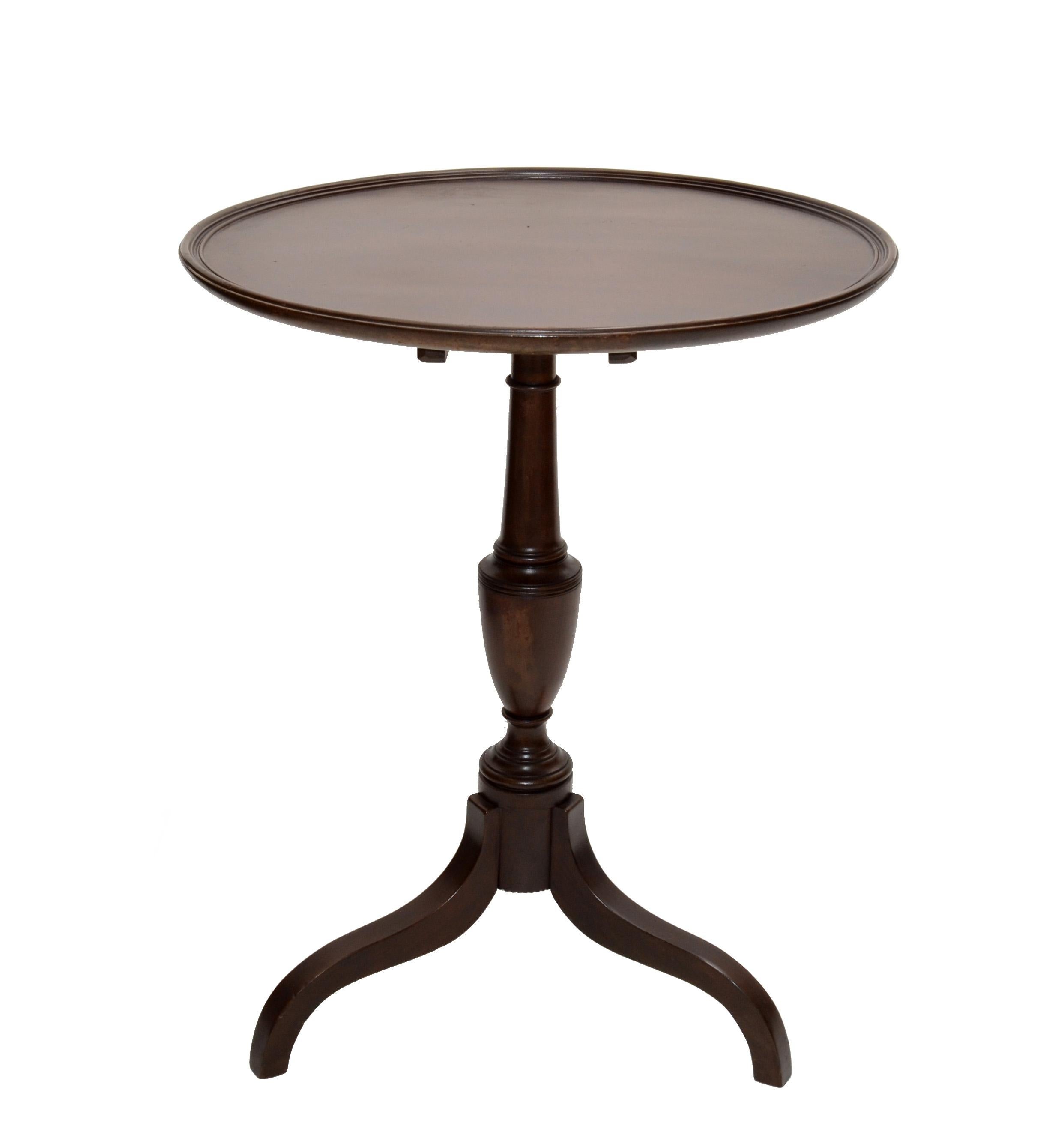 We offer an Victorian Style side table with turned wood pedestal stand made in the 1930s.
Has a Flip-Top which is secured to a Brass Lock underneath.
Folded easily in small Space.
Measures folded: 39.5 Height, Depth: 22.5 inches.
 