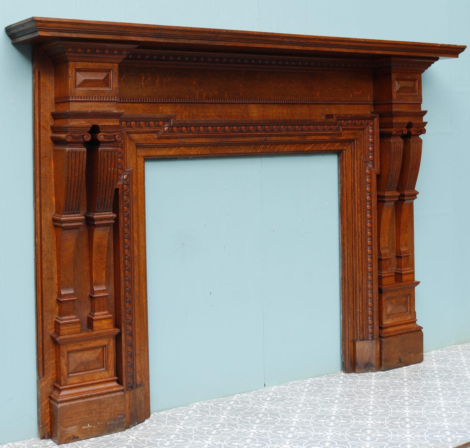 A very large and impressive Victorian period fireplace surround constructed from oak.

Additional dimensions:

Opening height 101.5 cm

Opening width 102 cm

Width between outsides of the foot blocks 194 cm.