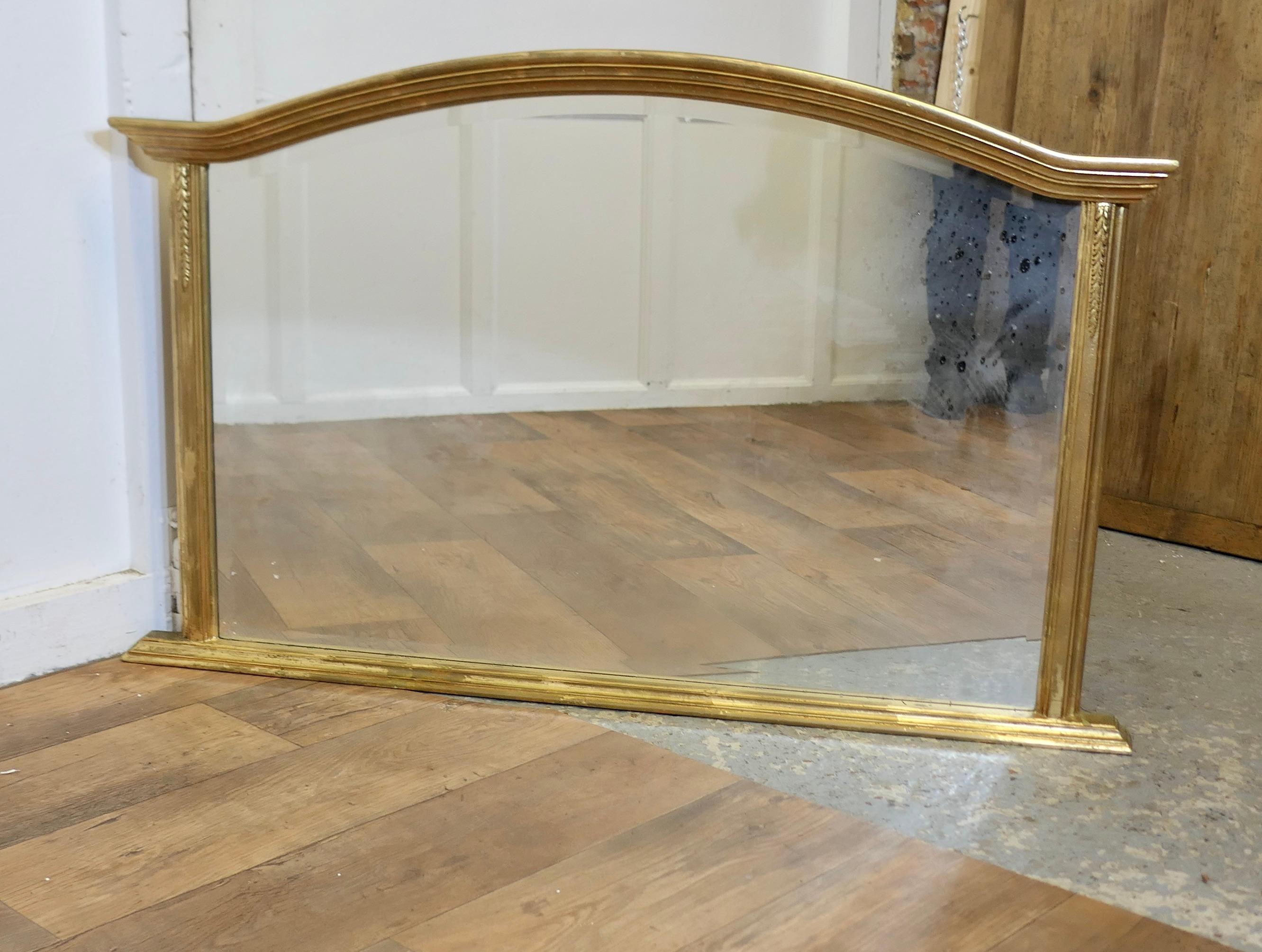 Victorian Style Arched Gold Overmantel Mirror

A Lovely Over Mantle Mirror 

This is a charming piece, the arched moulded frame is lightly curved with a flat base
The Mirror is in good attractive condition
The Mirror is 31” high, 49” wide and 3”