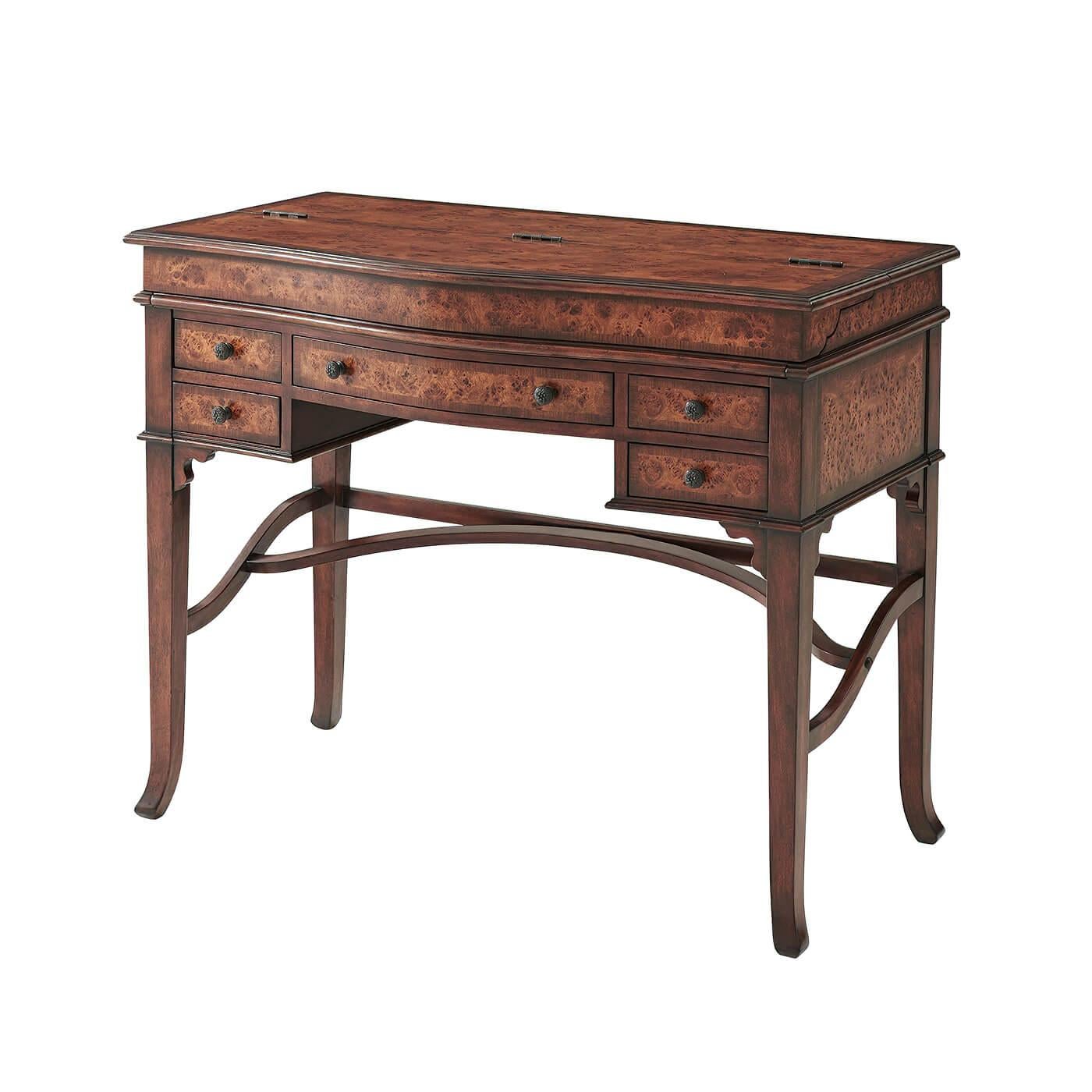 A poplar burl Campaign desk, the flip-top opening to reveal a fitted interior and a leather inset writing surface, five drawers below, tapering legs and stretchers. The original Victorian.

Dimensions: 42
