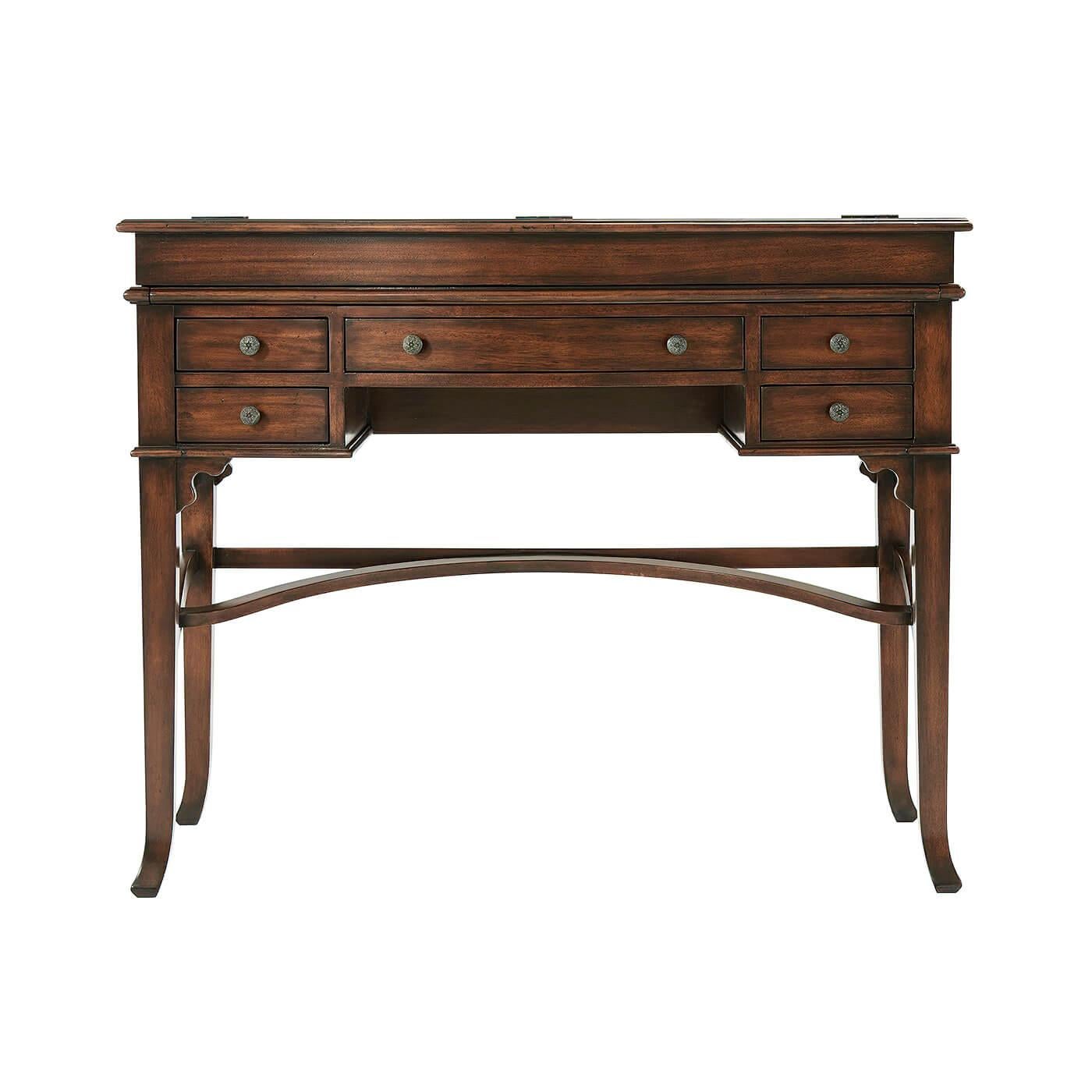 A Victorian-style bowfront Campaign desk, the flip-top enclosing a fitted interior and a leather writing surface, with five drawers surrounding the kneehole, on tapering splay legs joined by stretchers.

Dimensions: 42