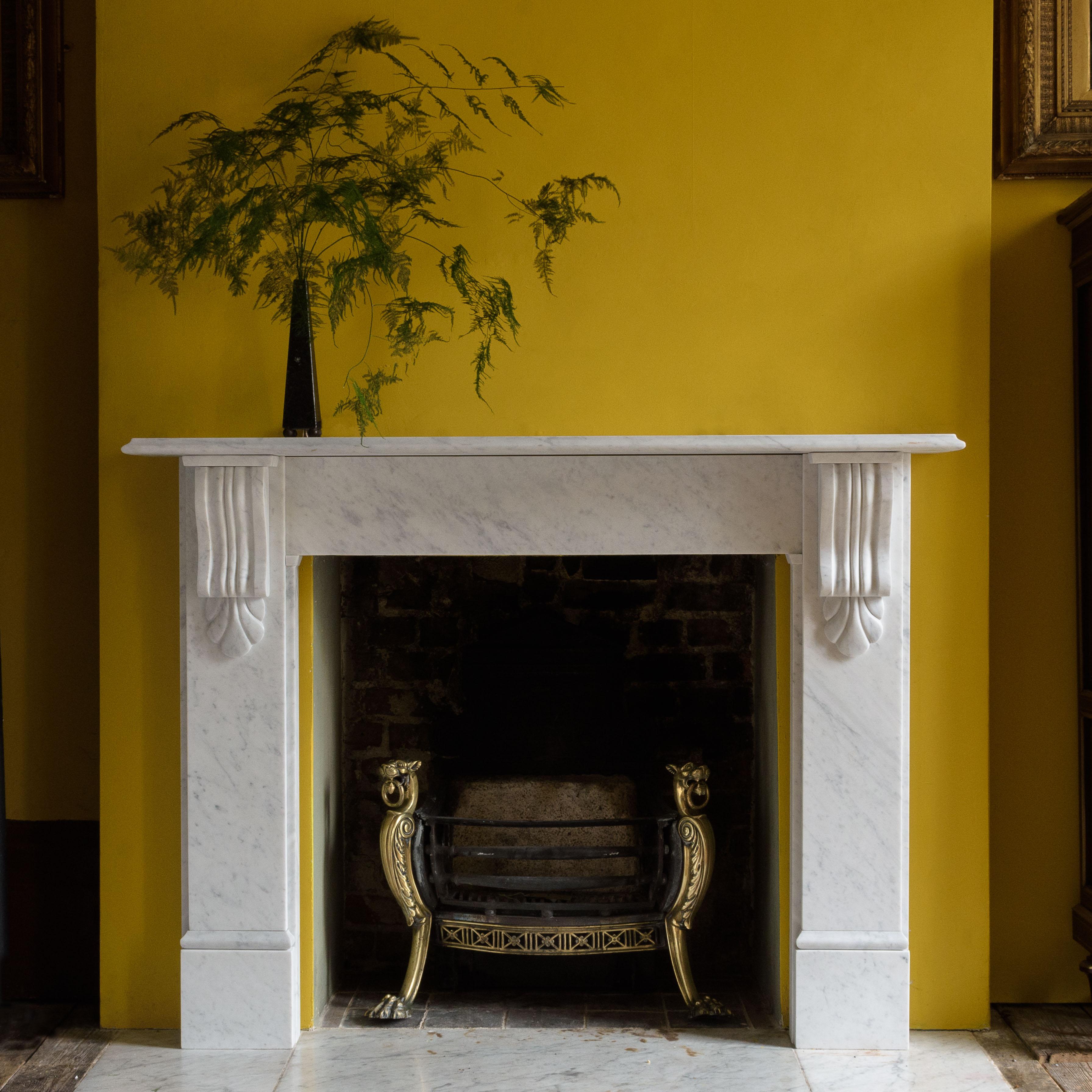 A classic Victorian style fireplace mantel, carved in Italian Carrara marble, the thumb molded shelf above plain frieze flanked by corbelled jambs, on plain foot blocks. Aperture width 92 cm x 91 cm high.

 
