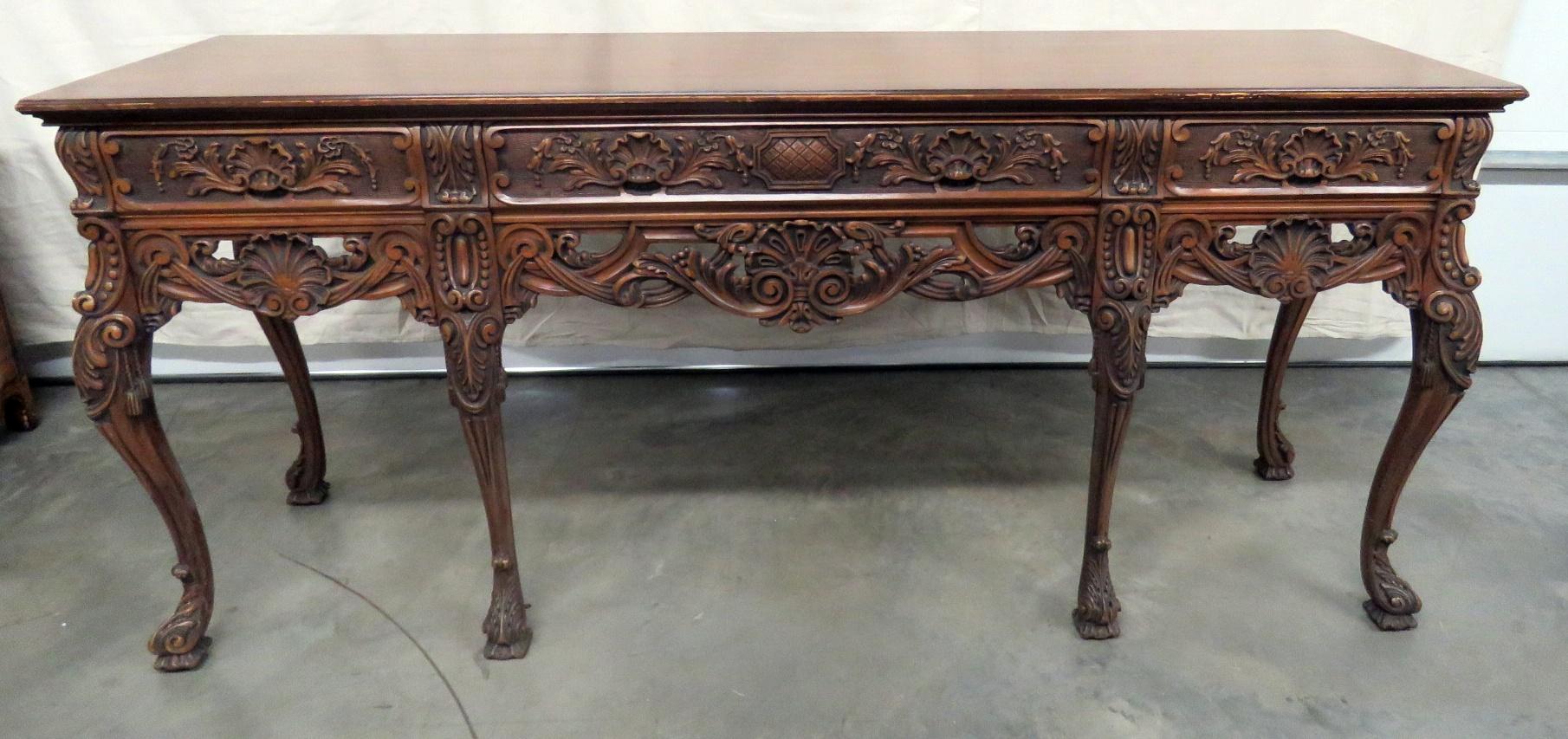Georgian style carved 3-drawer sideboard. The end drawers are felt lined.