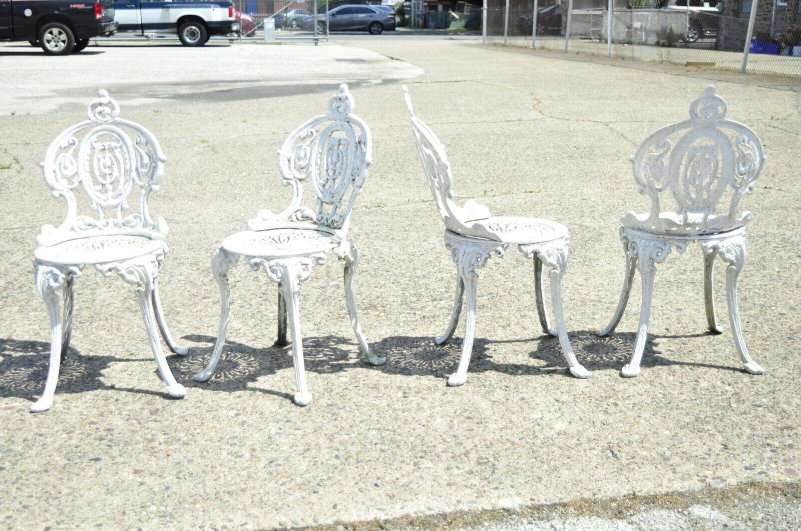 Victorian style cast aluminum ornate outdoor garden chairs - set of 4. Item features (4) side chairs, nice small size, ornate design, great style and form. Circa mid 20th century. Measurements: 32