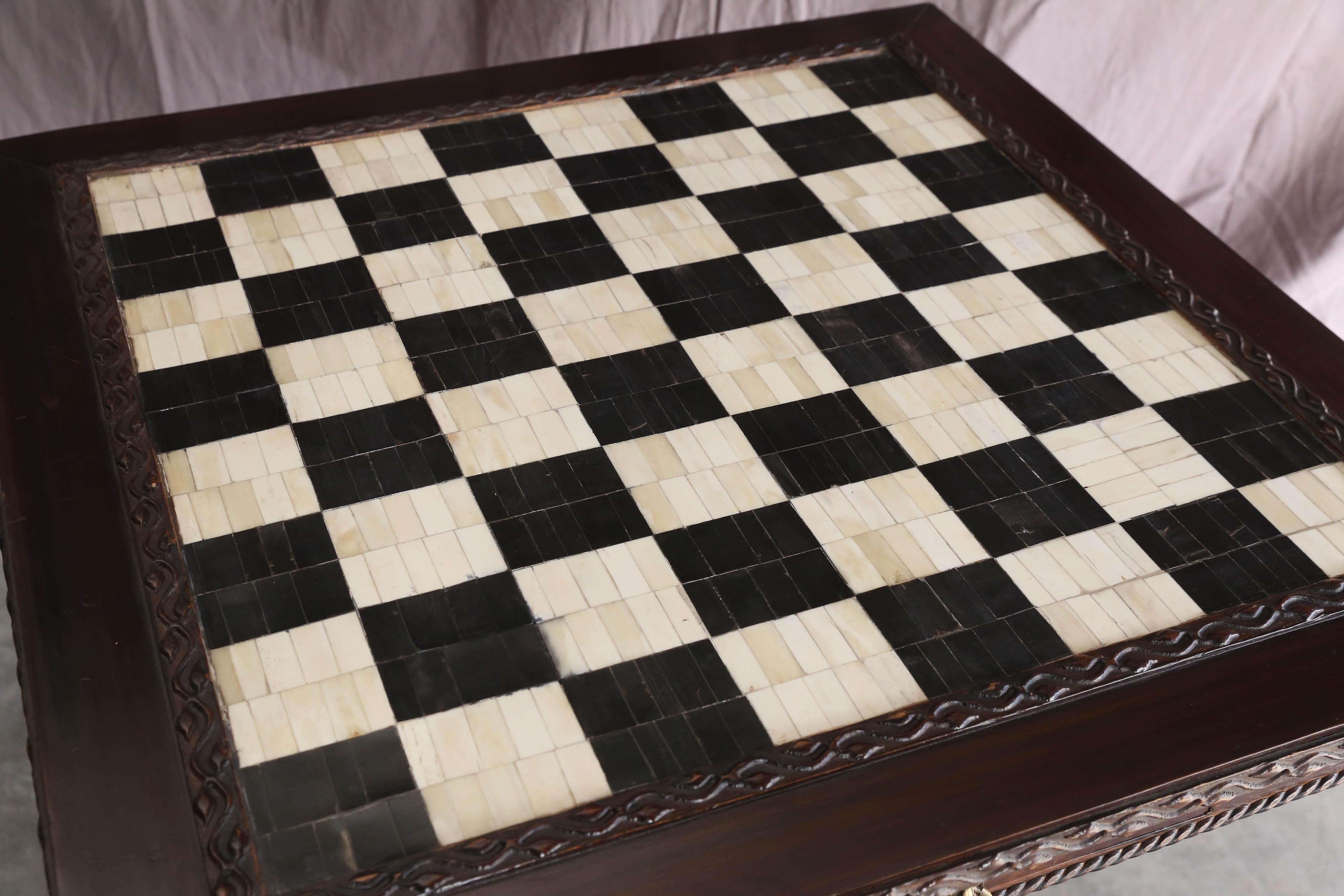A solid teak wood hand-carved and handcrafted chess table with the squares inlaid with bones and buffalo horn.
It was made on commission in Central India and was part of the dowry given by a bride to the groom. It will be a treat for chess lovers