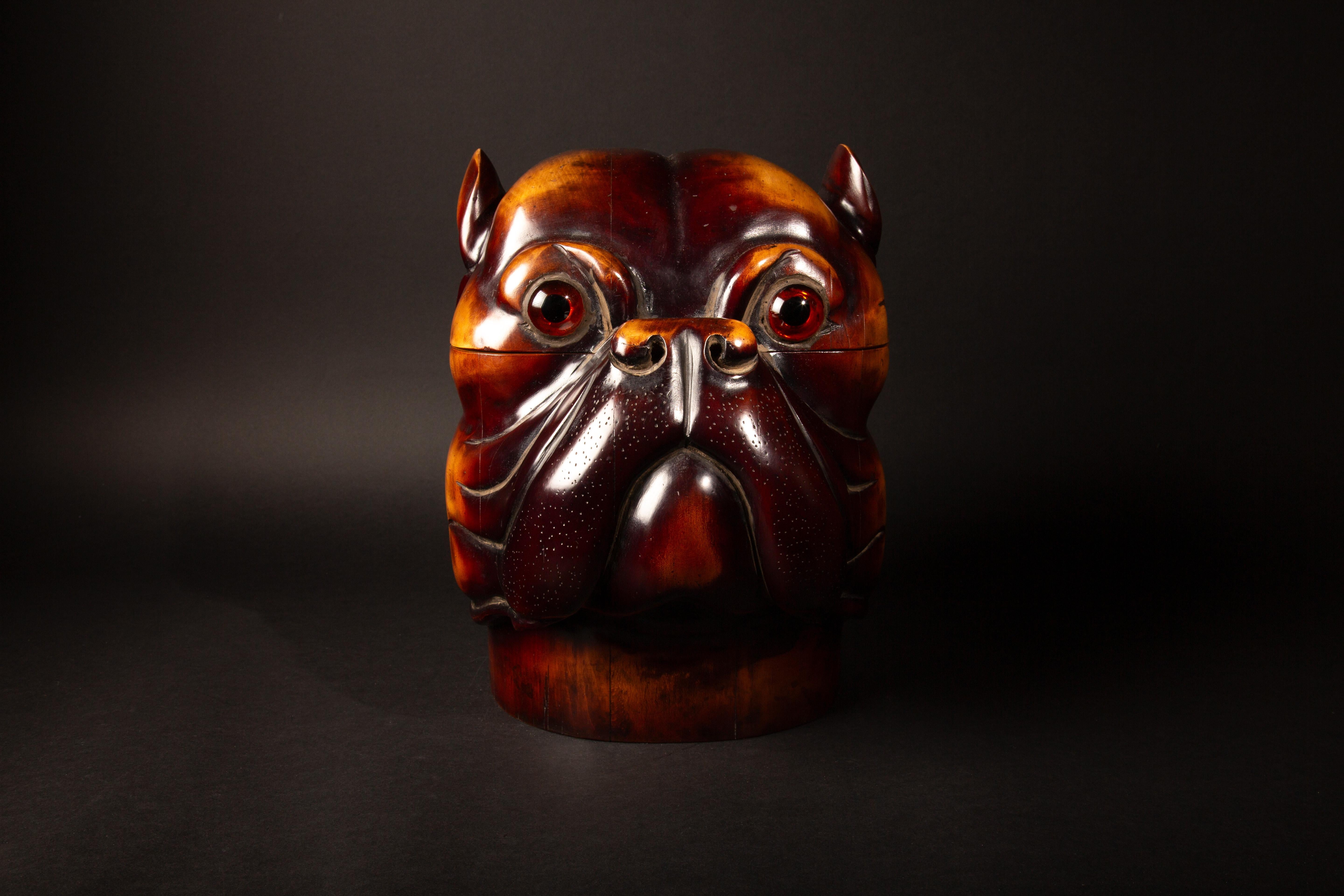 These exquisitely crafted Victorian-style humidors/boxes are masterfully carved from high-quality wood into the likeness of a dog's head. Each piece features a hinged top that smoothly opens to reveal a spacious hollow interior, ideal for storing a