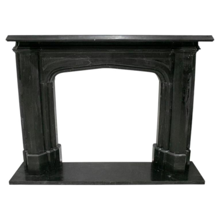 Victorian Style English Fireplace in Belgian Black Marble with Tudor Arch Shape For Sale