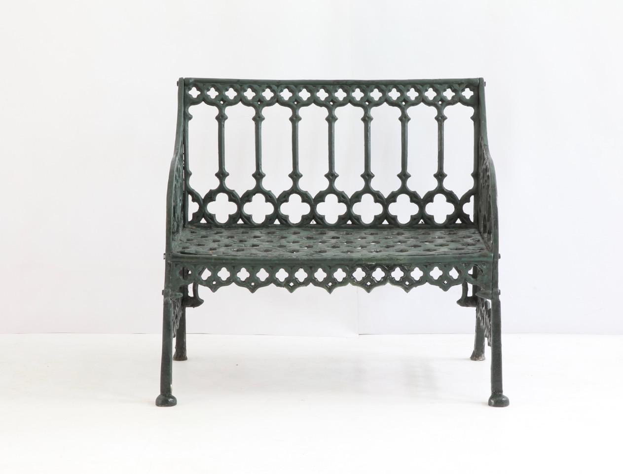 An English Victorian style, green painted garden bench.


