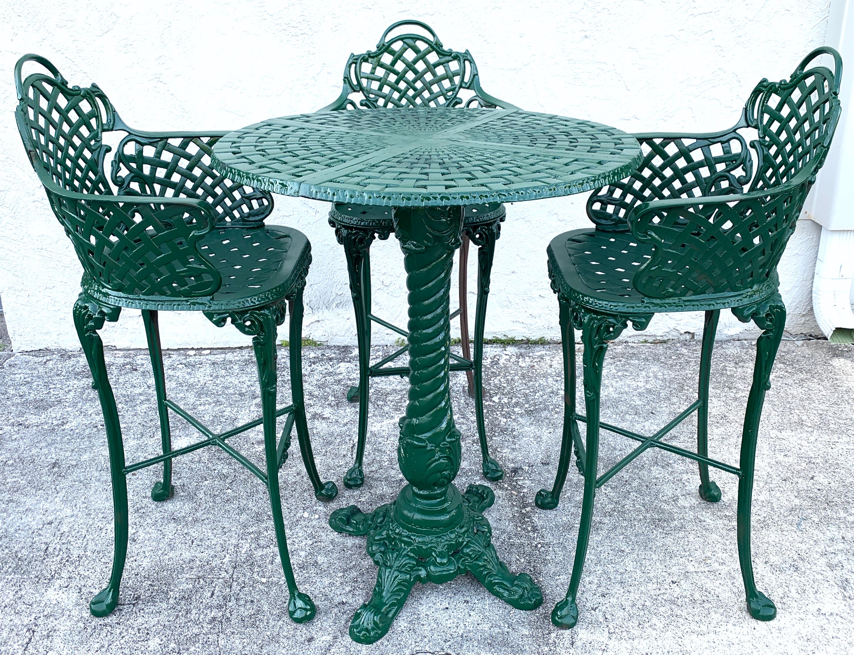 Victorian style garden/Patio hightop table and 3 chairs, provenance: Celine Dion
In the French style consisting of a pierced high top table and three woven tall chairs/stools
The table measures: 32