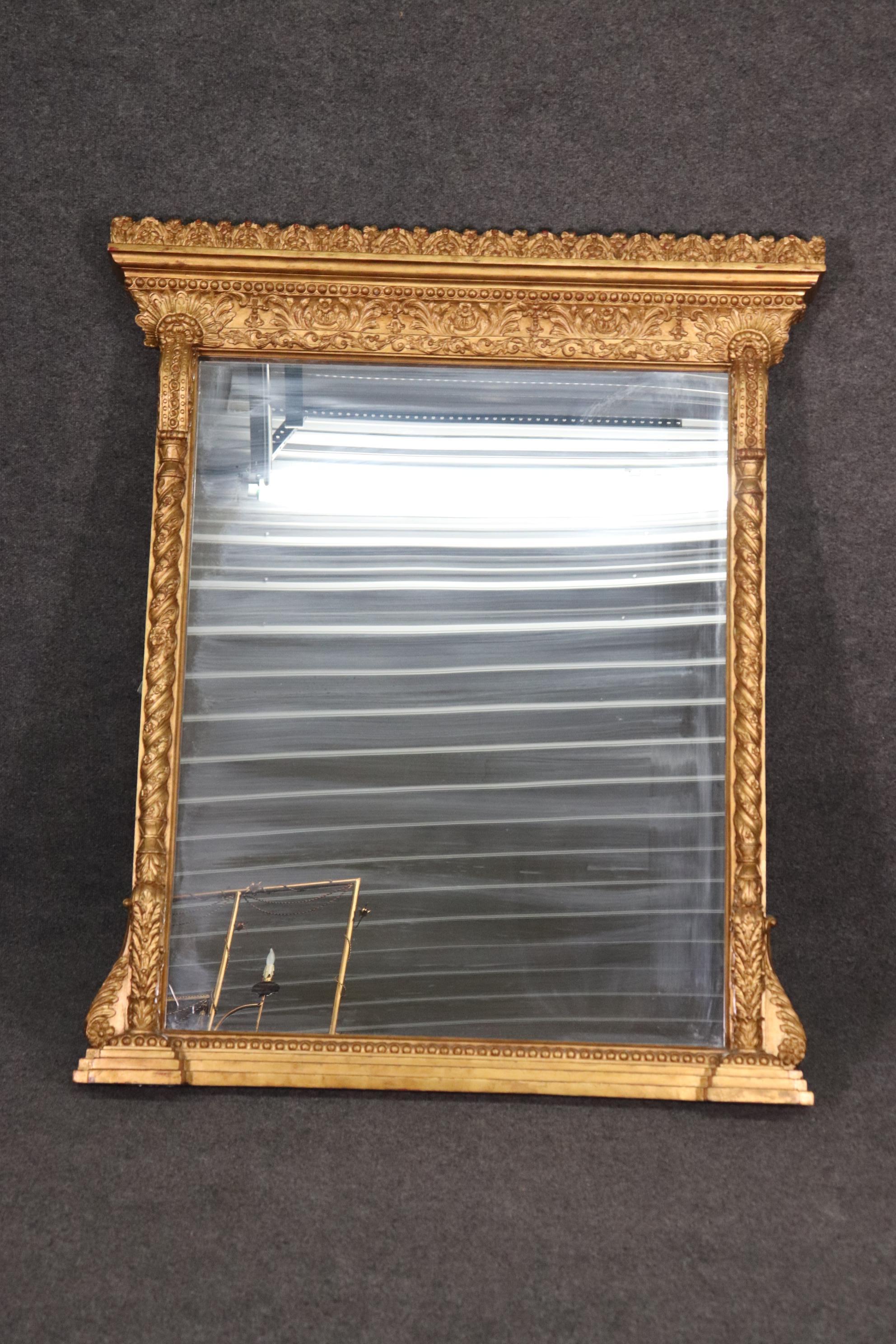 This is a genuine gold leaf gilded Martha Stewart mirror. The mirror is perfect for a mantle or even above a buffet. The mirror measures 53 tall x 44.5 wide x 4 deep. The mirror dates to the 1990s and is in very good condition.