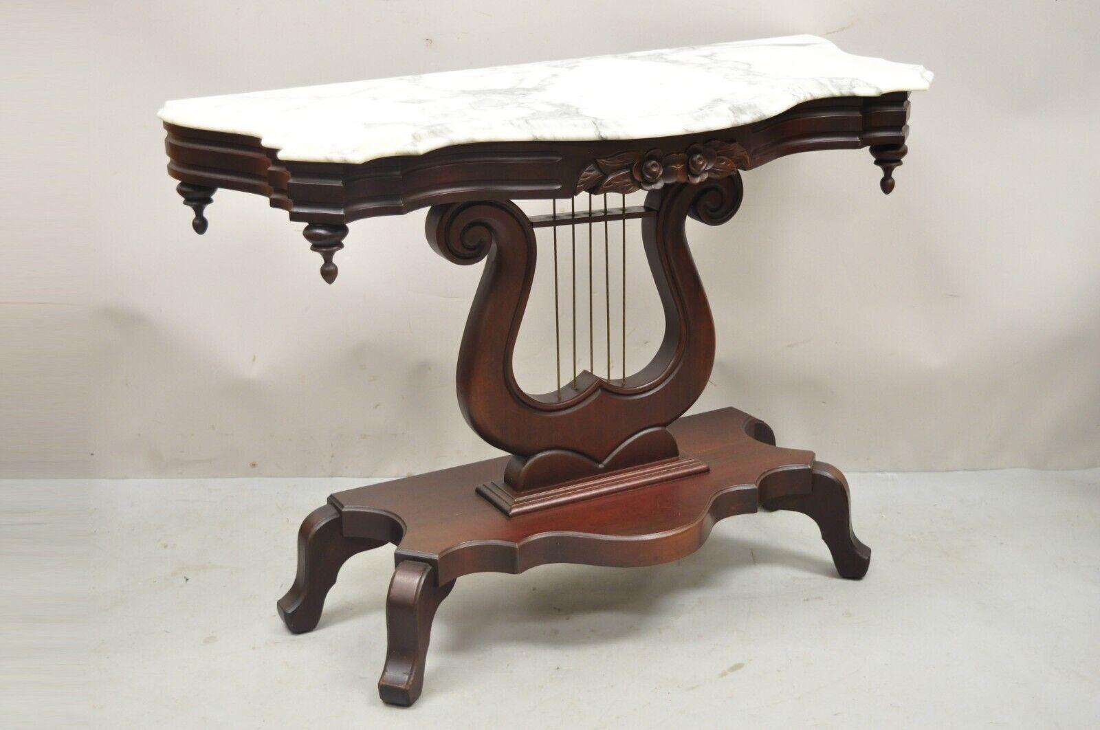 Vintage Victorian style J.B. Van Sciver marble top Mahogany Harp Lyre console table. Item features shaped Italian marble top, mahogany carved harp base with brass 