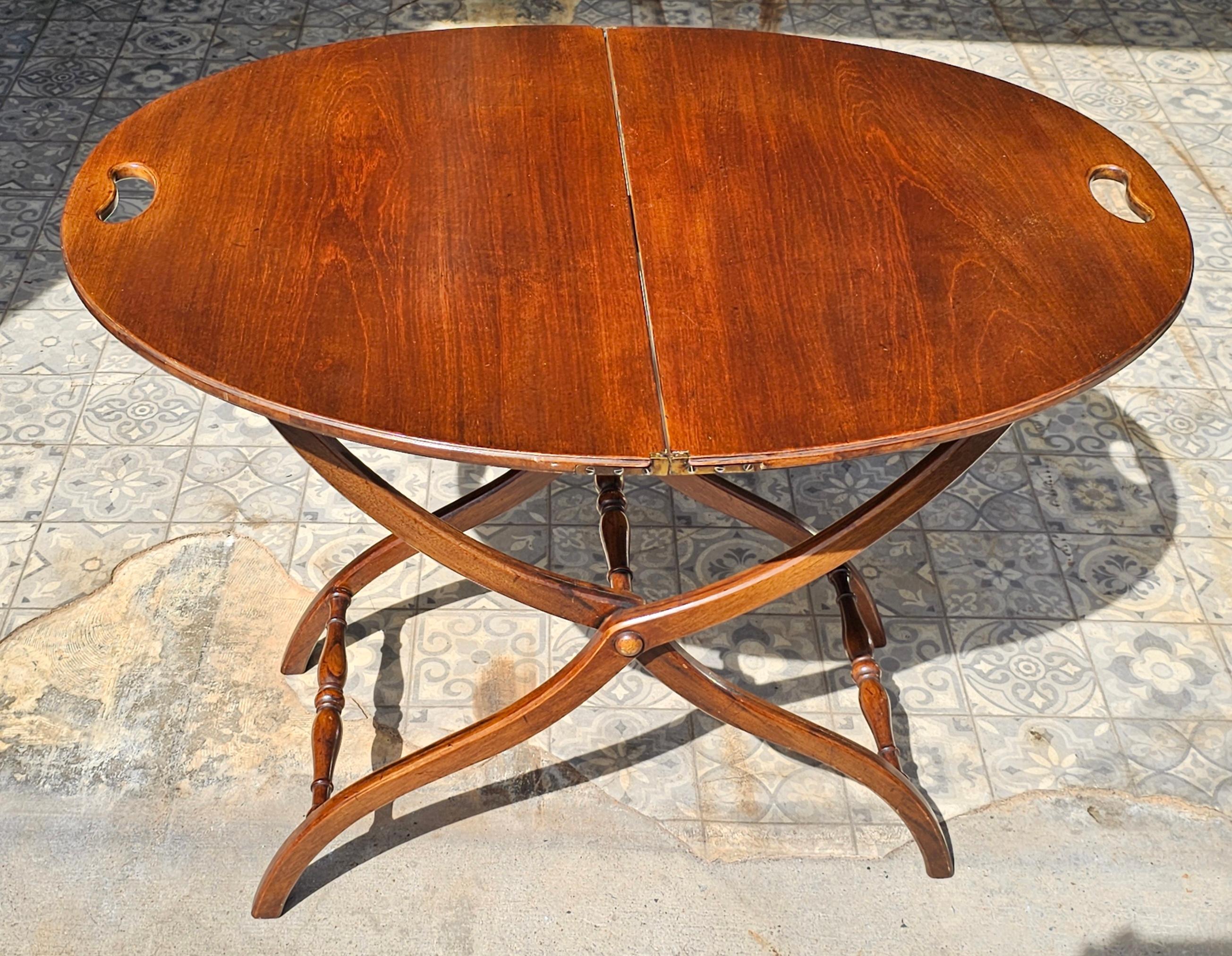 A Victorian Style Mahogany Folding Oval Table. Multi use purpose as Map Table, Desert Table, etc..
 Measures 36