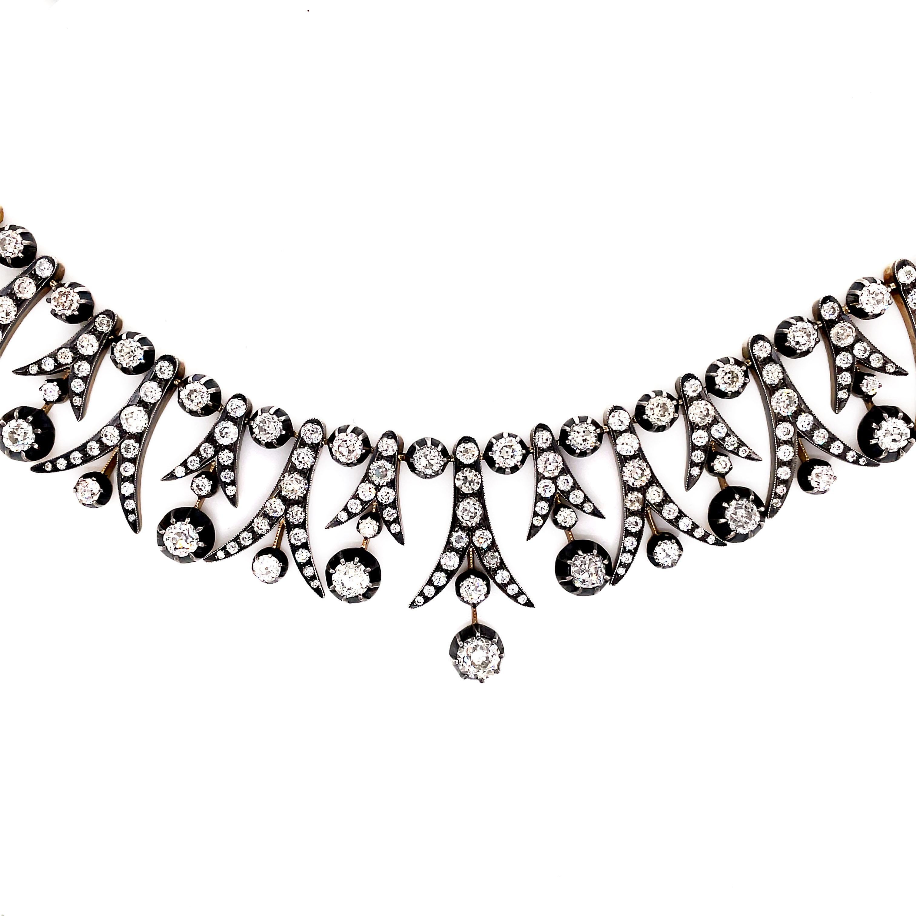 Exquisite Victorian style necklace set with 255 round old cut diamonds ranging from 0.02 carats to 0.70 carats with an approximate weight of 40.00 carats total. All stones are mounted in silver on gold, six claw and grain settings. This piece is a