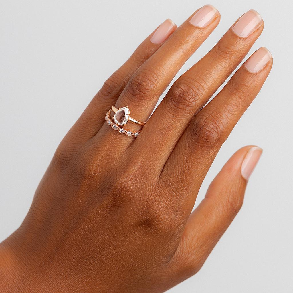 This is a vintage-inspired ring made in Los Angeles and modeled after a very special Victorian ring that was in our collection. The 18k rose gold solitaire centers an amazingly unique Pear Shaped Rose Cut diamond weighing 1.39ct and accompanied by a