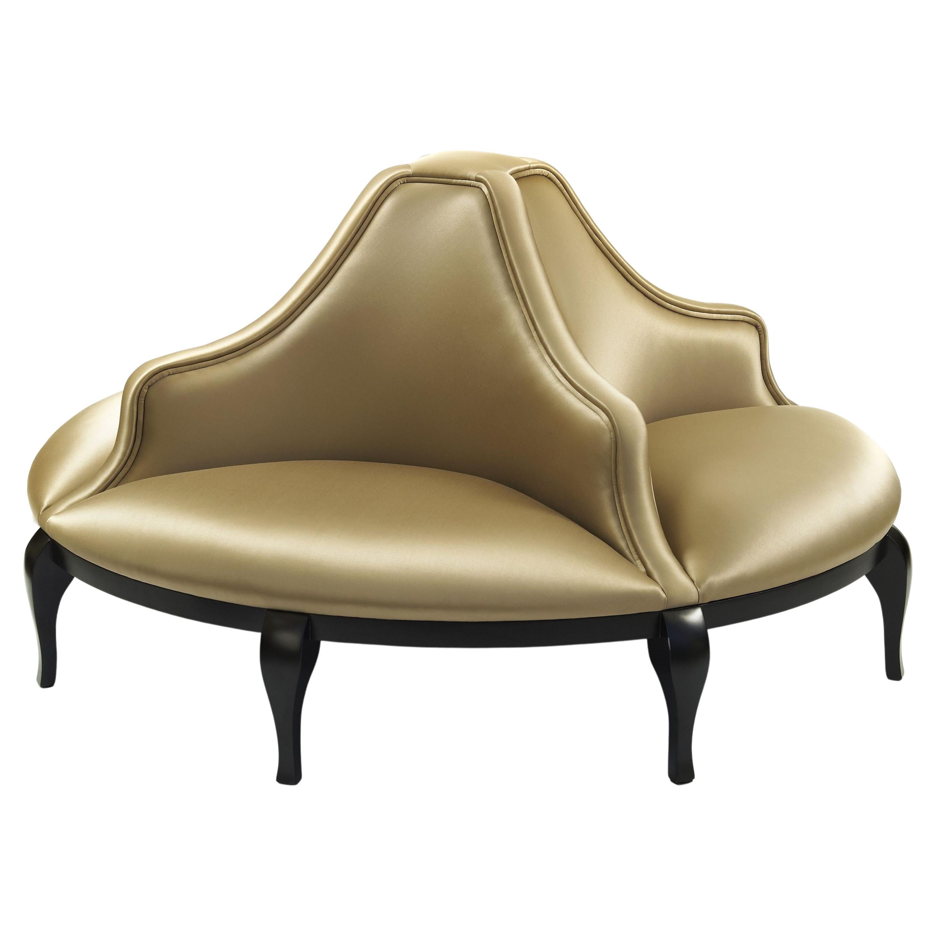 This round sofa is a revisited icon from the Victorian Era. Bright, light and feminine, this opulent signature piece is the perfect setting for a flirting scene from any given British literature classic. It serves as a bold design element in the
