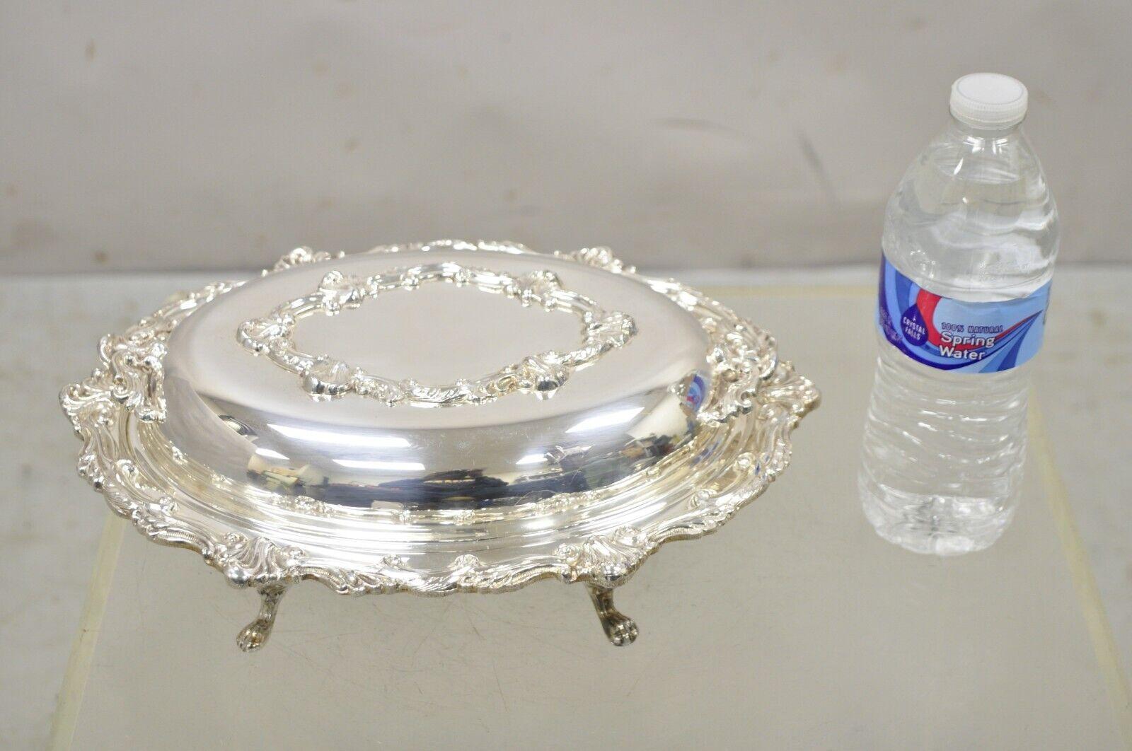 Victorian Style Silver Plated Ornate Lidded Twin Handle Vegetable Serving Dish. Item features ornate lidded dish, divided glass insert, ornate twin handles, original hallmark, very nice vintage item, great style and form. circa Mid-20th century.