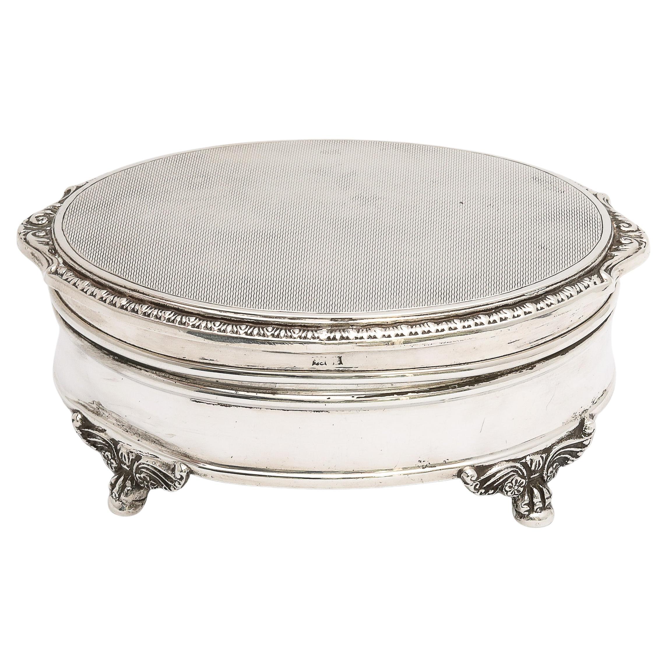 Victorian-Style, sterling silver jewelry/trinkets box, having paw feet and a  hinged lid Birmingham, England, year-hallmarked for 1960, Adie Bros. - makers. Lid is engine-turned in design and has a gadrooned border. Underside of lid is gilded. The