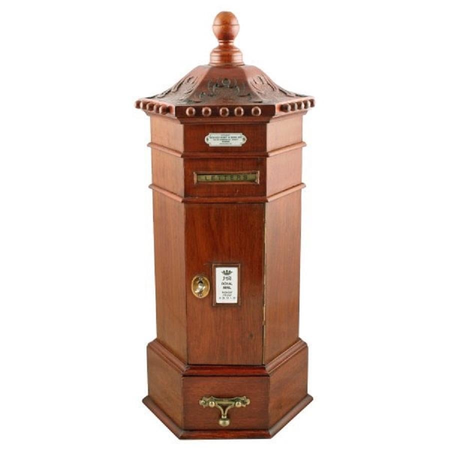 A 20th century copy of a Victorian mahogany miniature letter box.

The table top letter box is a detailed replica of an original Victorian model that could have been used on hotel counters or in an estate office.

The letterbox is hexagonal in