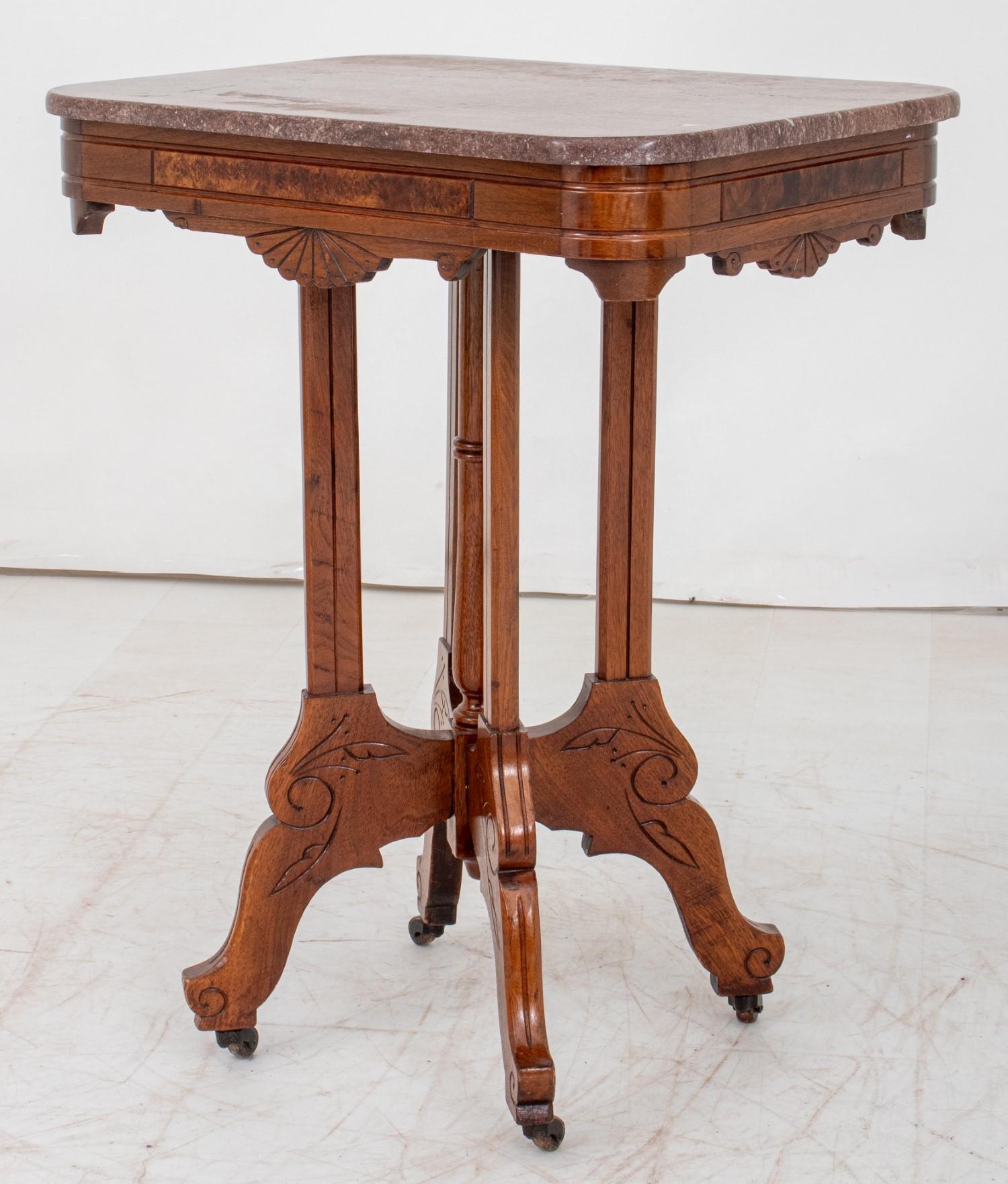 Victorian Style Walnut Marble Top Table with  incised decoration foliate decoration and  burl wood trim, on four legs with casters.  30-inch height, 23.75-inch width, and 17-inch depth, this table is perfect for smaller spaces or as an accent piece