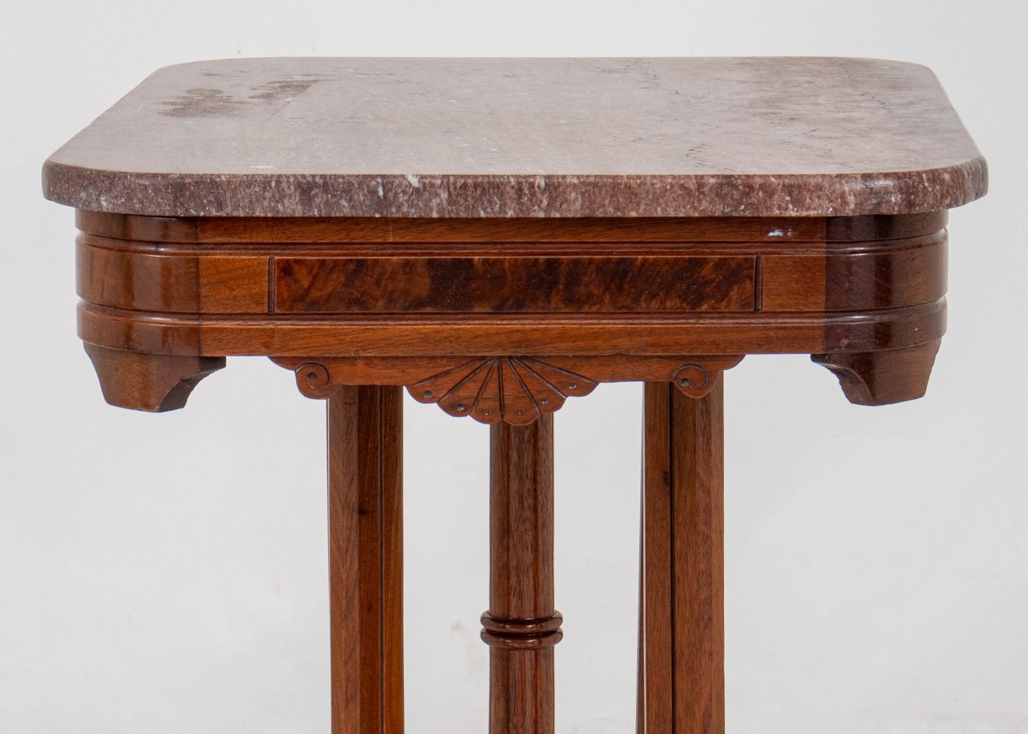 
Victorian Style Walnut Marble Top Table
This description details a Victorian style side table with several characteristic features:

Key features:

Style: Victorian
Material:
Top: Marble
Base: Walnut with burl wood trim
Decoration: Incised foliate