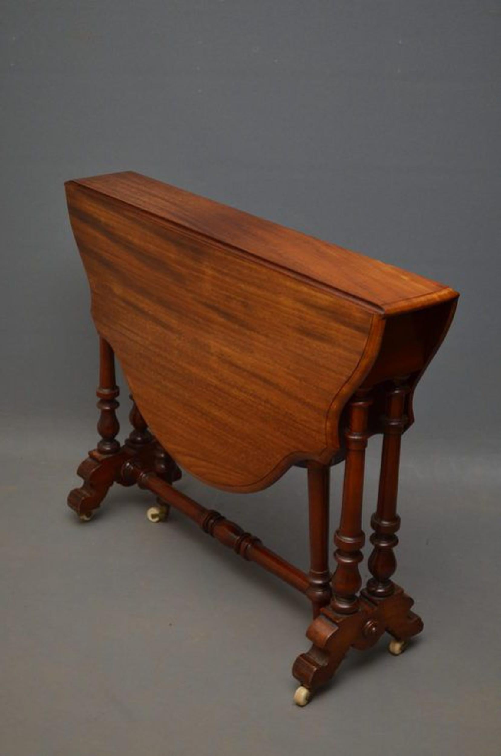 SN934 Victorian, mahogany drop leaf table, having shaped top with moulded edge, turned strecher uniting a pair of turned supports, terminating on shaped feet with original castors. Practical, occasional table that is very slim when not in use, all