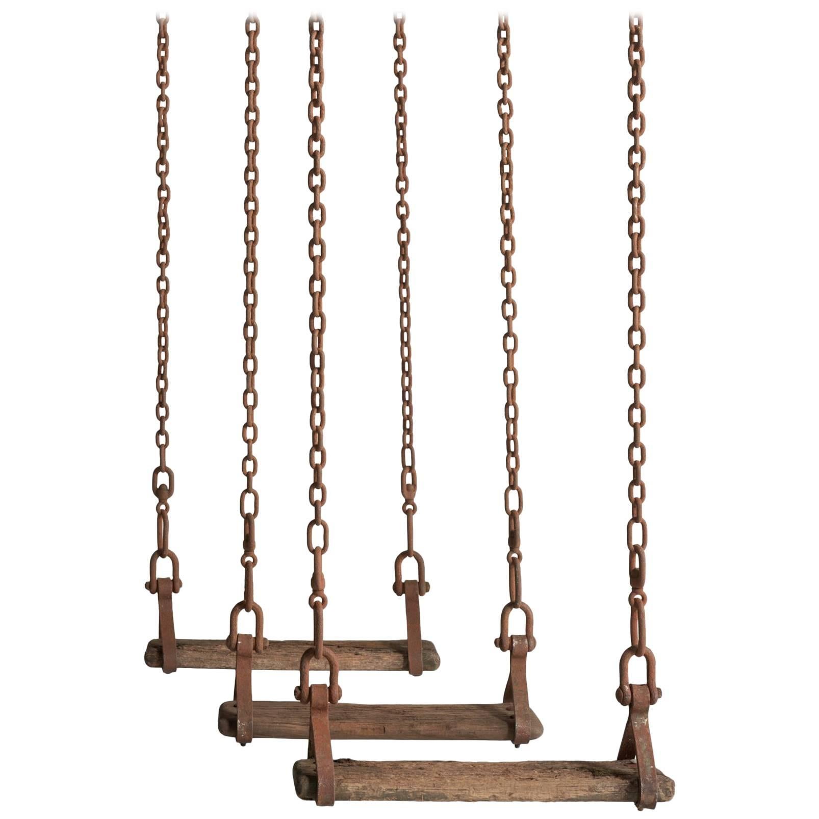 Victorian Swings, England, circa 1890.

Forged iron chain with timber seats.

(Two available).