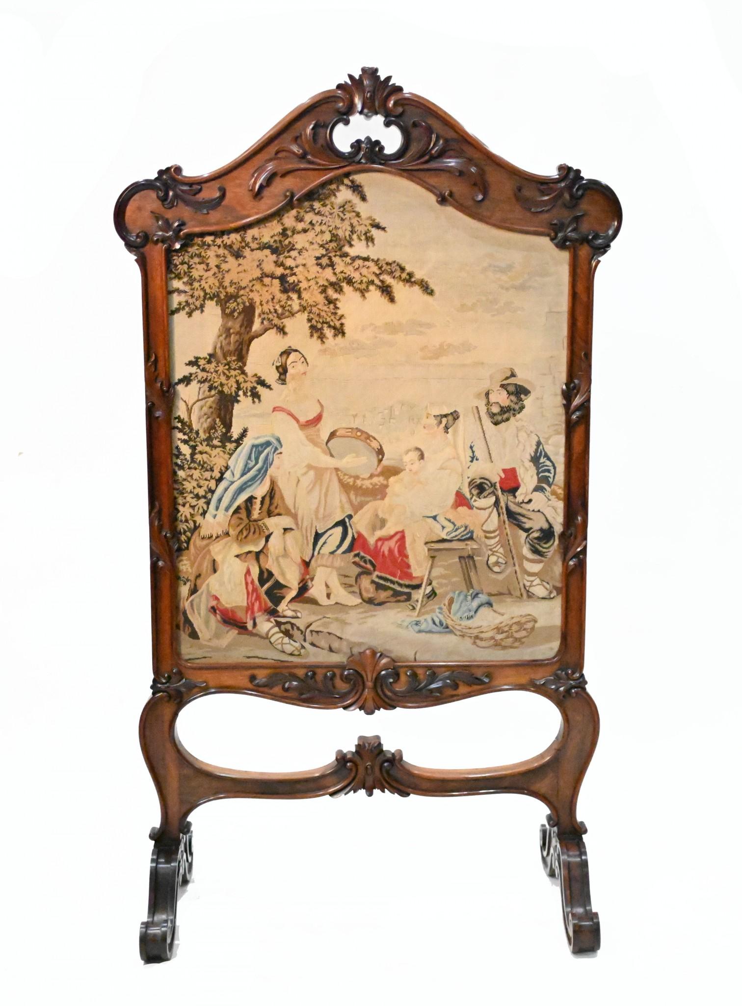 Wonderful Victorian tapestry screen showing a delightful English pastoral scene
We date this to circa 1840 and it comes in the mahogany frame which features hand carved details
The scene shows the group frolicking under the tree with the maiden