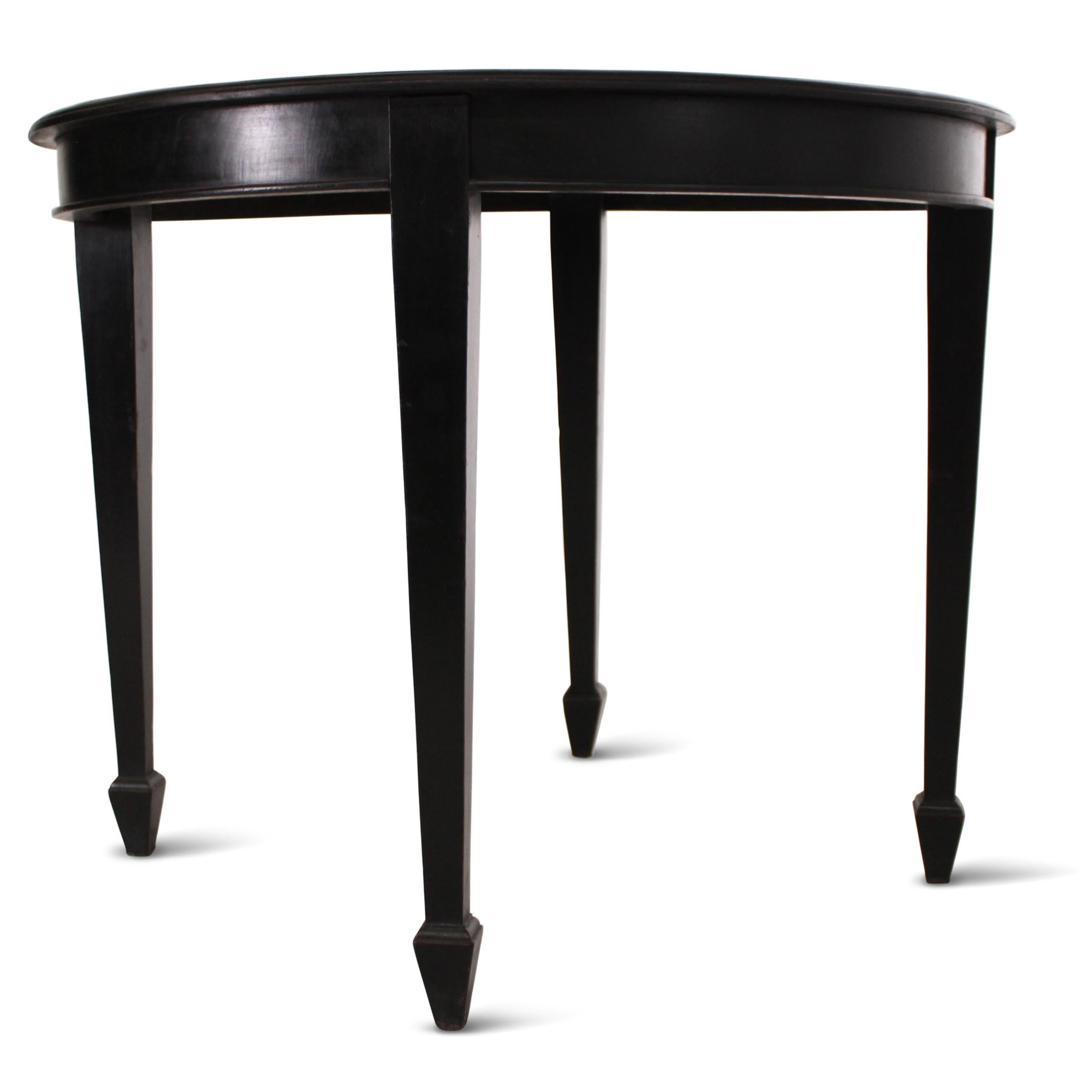 A Victorian teak center table, originating from a palace collection, featuring elegantly tapered feet and a sturdy wooden top. The table retains its original polish, enhanced by a beautiful, aged patina.