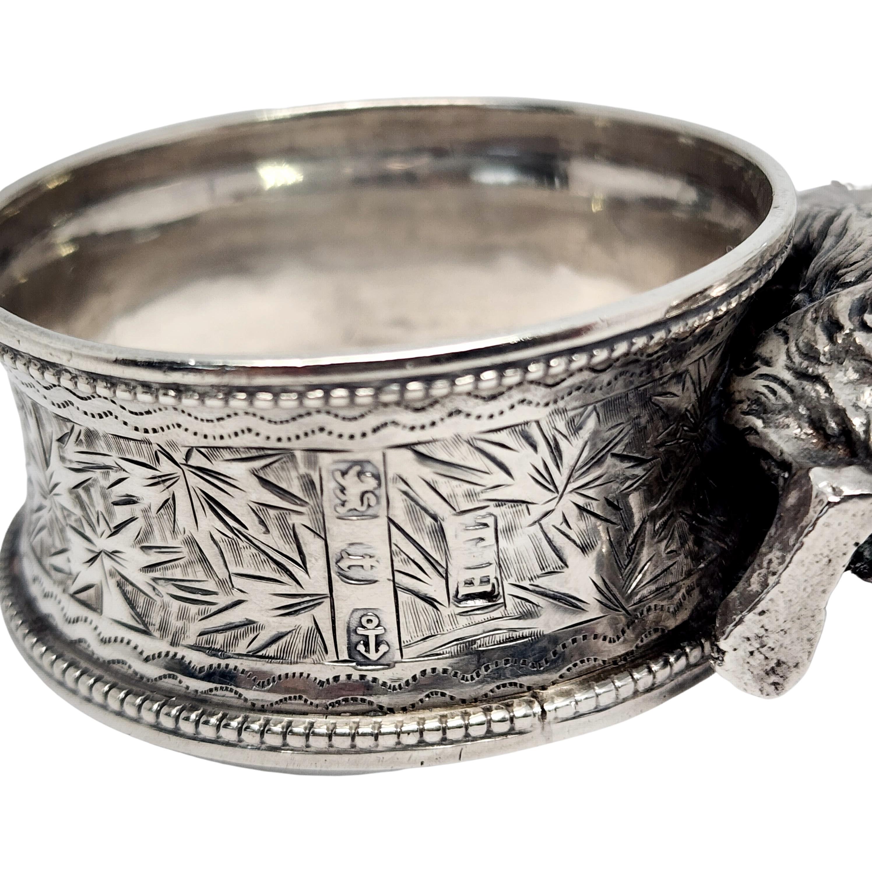 Victorian sterling silver applied rabbit napkin ring by Thomas Hayes of Birmingham England with monogram. Circa 1893.

Monogram appears to be VMH

Etched design around the ring with a monogram at the top in a cartouche, beaded edging. Large figural