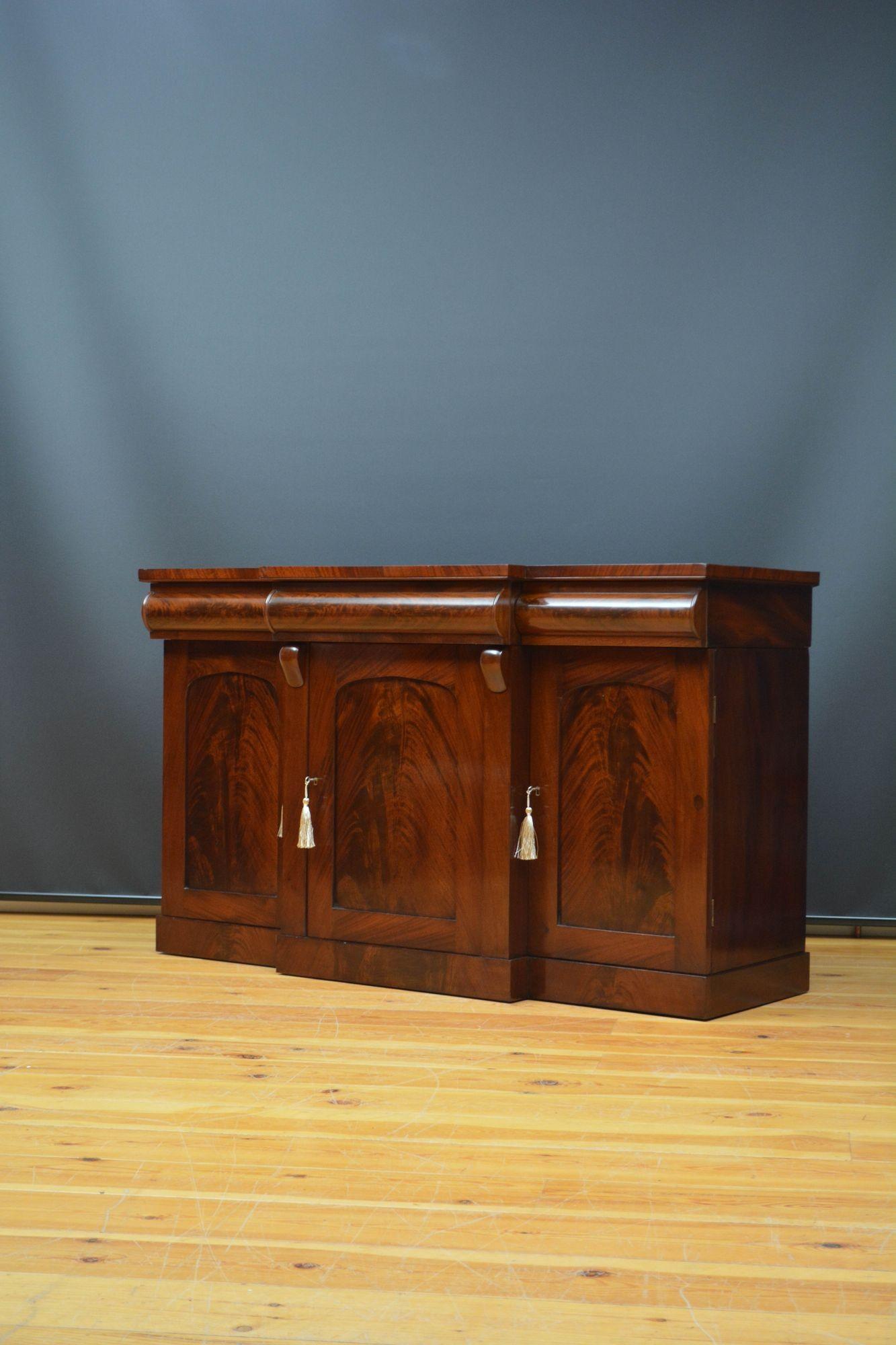 Sn5613 Attractive Victorian breakfronted mahogany sideboard, having well figured top above three cedar lined cylindrical drawers and three arched and panelled cupboard doors, enclosing shelves and a deep drawer, all fitted with original working