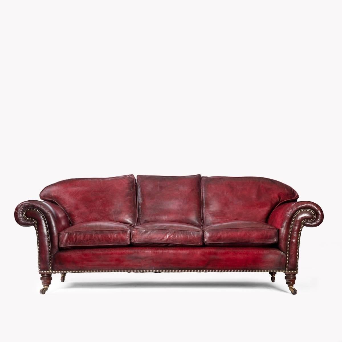 Late Victorian three-seat chesterfield sofa set upon four turned mahogany feet. Recovered in distressed leather.

Measures: H 31”
Max width 85”
Max depth 33”
Depth of seat including the cushion 29”
Width of seat 62”.