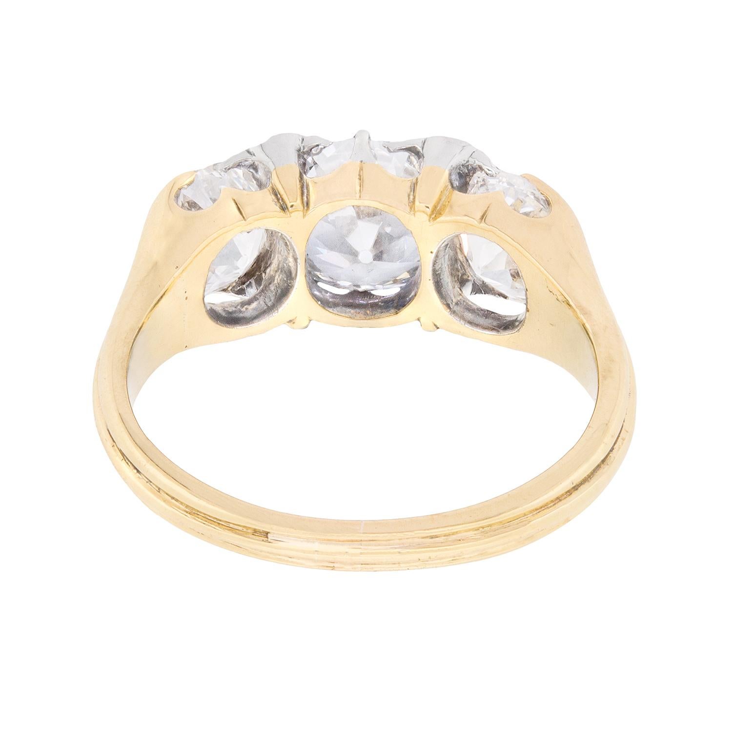 This breath taking three stone diamond ring is a beautifully hand made ring dating back to the 1900s. Classically Victorian in style, it features a centre stone weighing 1.40 carat and flanking either side are two stunning 0.85 carat old cuts. The