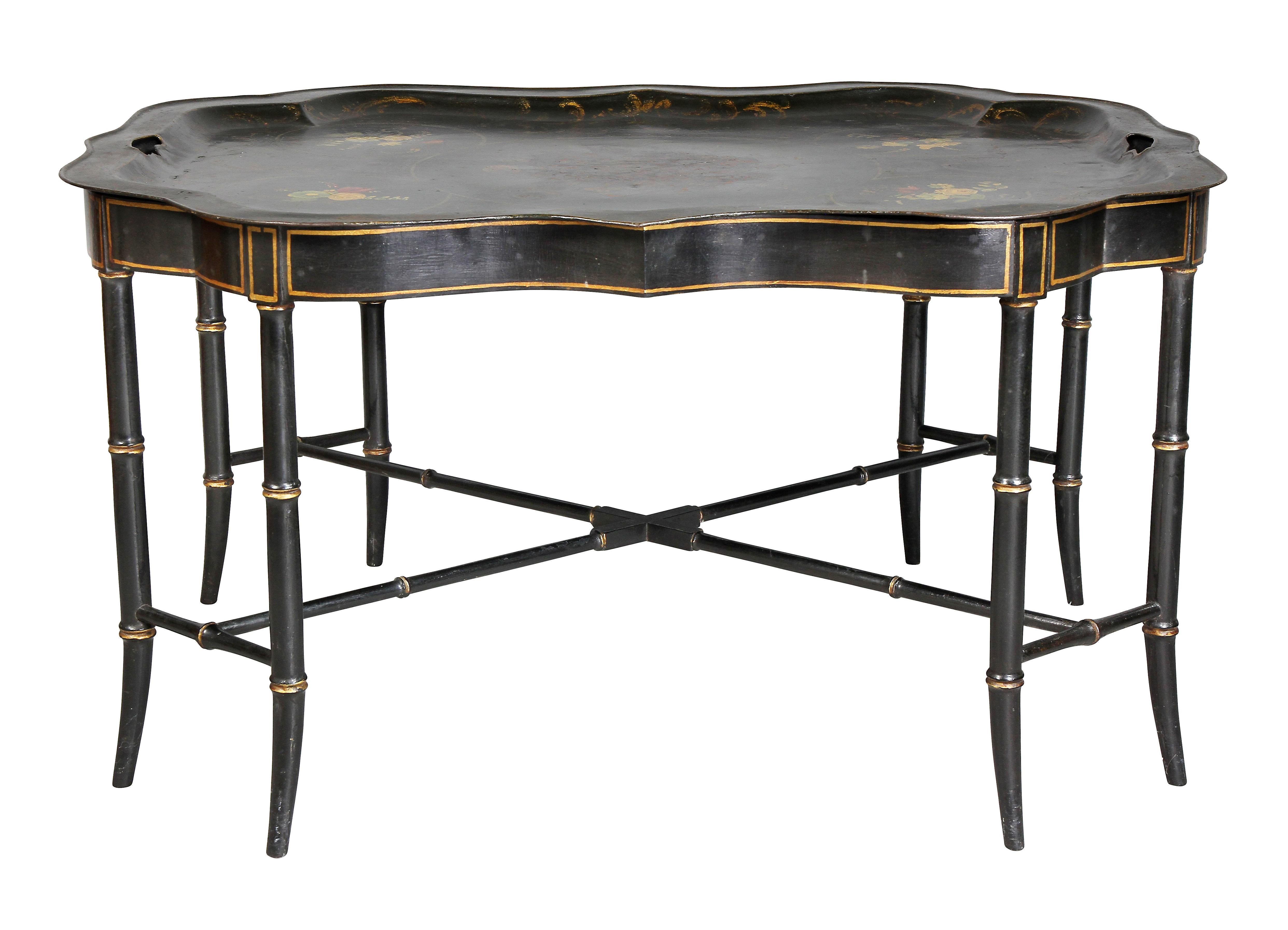 Shaped black tray with floral decoration with handles, set in a modern ebonized bamboo turned base. Provenance; John Volk Estate, Palm Beach.