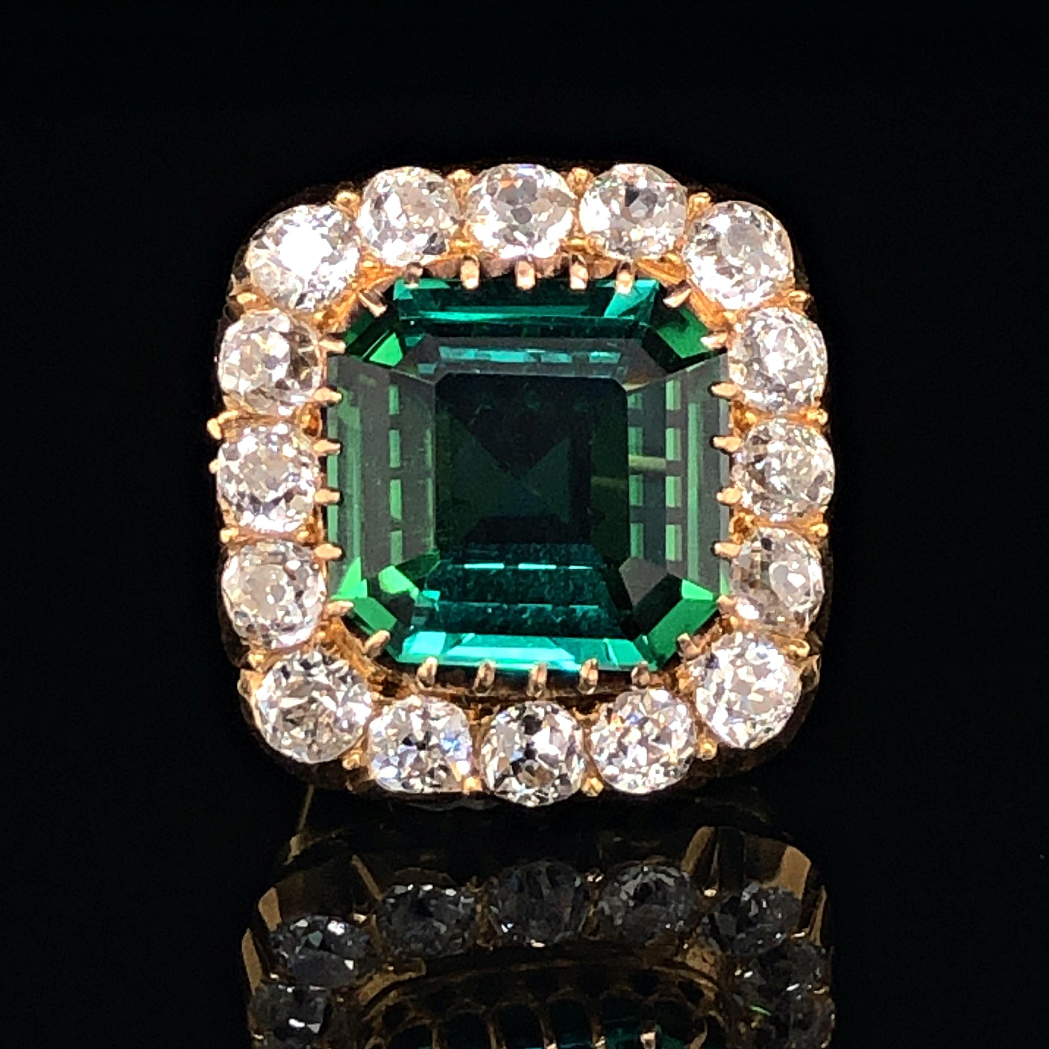 A beautiful tourmaline and diamond brooch in yellow gold, Victorian, ca. 1880s. 
The octagonal square shaped tourmaline weighs 5.15 carats and has a stunning crystal and mint blue-green colour. It is a very clean gem and free of inclusions. The
