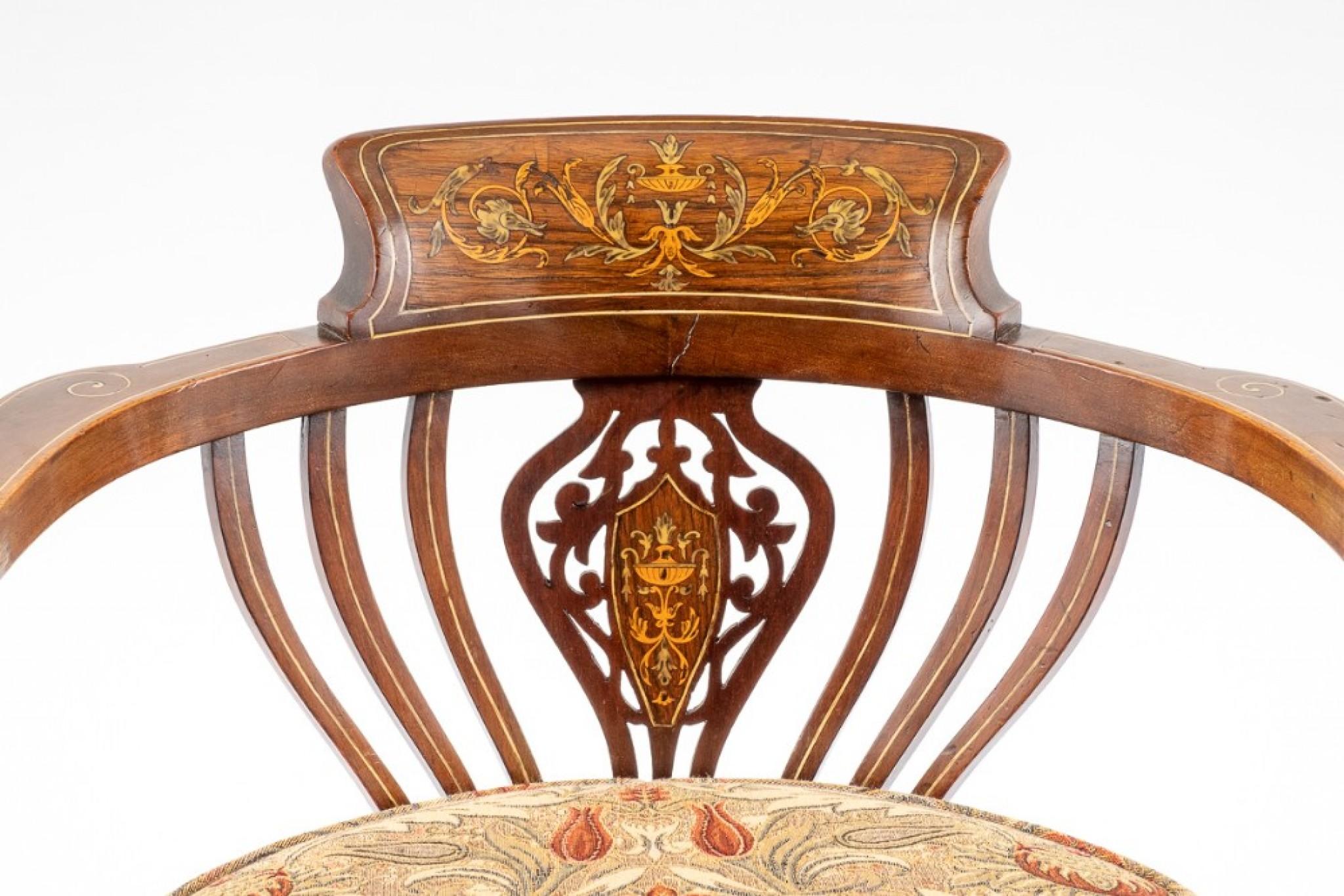 This pretty mahogany inlaid tub chair is from the late victorian period.
The front legs being of a cabriole form with swept back legs.
Circa 1880
Having elegant shaped arms and supports.
The pierced back rest featuring decorative marquetry