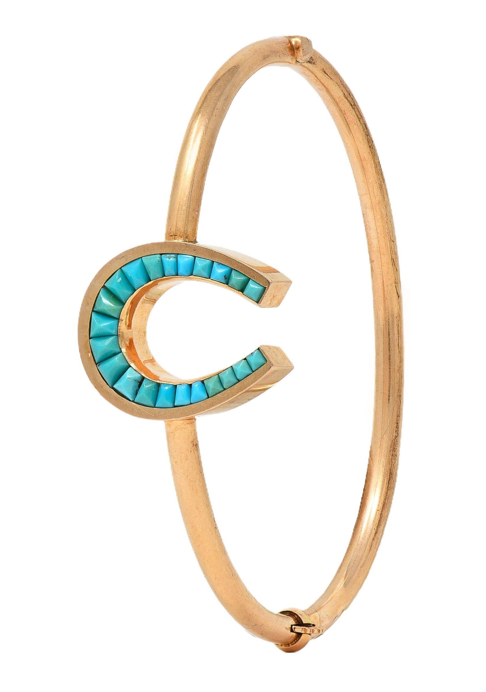 Designed as an oval-shaped bangle featuring a horseshoe motif station
Channel set with graduated calibre cut turquoise cabochons 
Opaque light greenish blue to robin's egg blue in color 
Ranging in size from 1.7 x 1.7 mm to 2.5 x 3.0 mm 
Opens on a