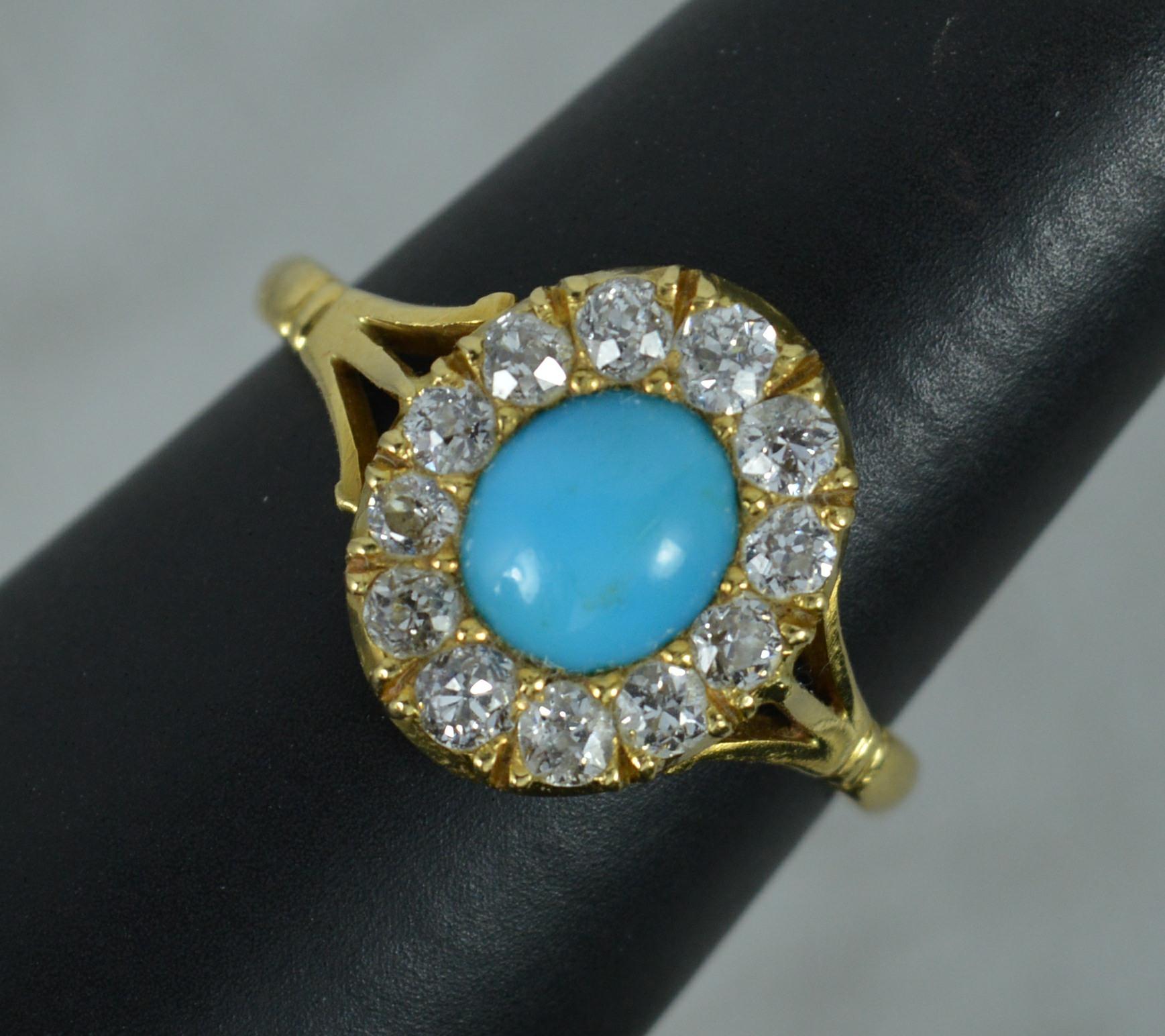 A stylish Victorian period cluster ring. c1880.
18 carat yellow gold example.
Designed an oval turquoise to the centre with twelve natural old European cut diamonds surrounding. Vs clarity, f-g colour. Very sparkly.
11mm x 13.5mm cluster head.