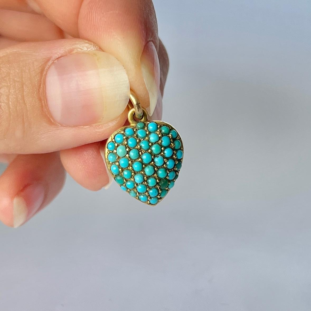 This gorgeous heart locket is covered with turquoise and when you turn over to the back there is a locket panel holding a lock of hair. Modelled in 15ct gold. 

Dimensions: 15x13mm

Weight: 3.1g