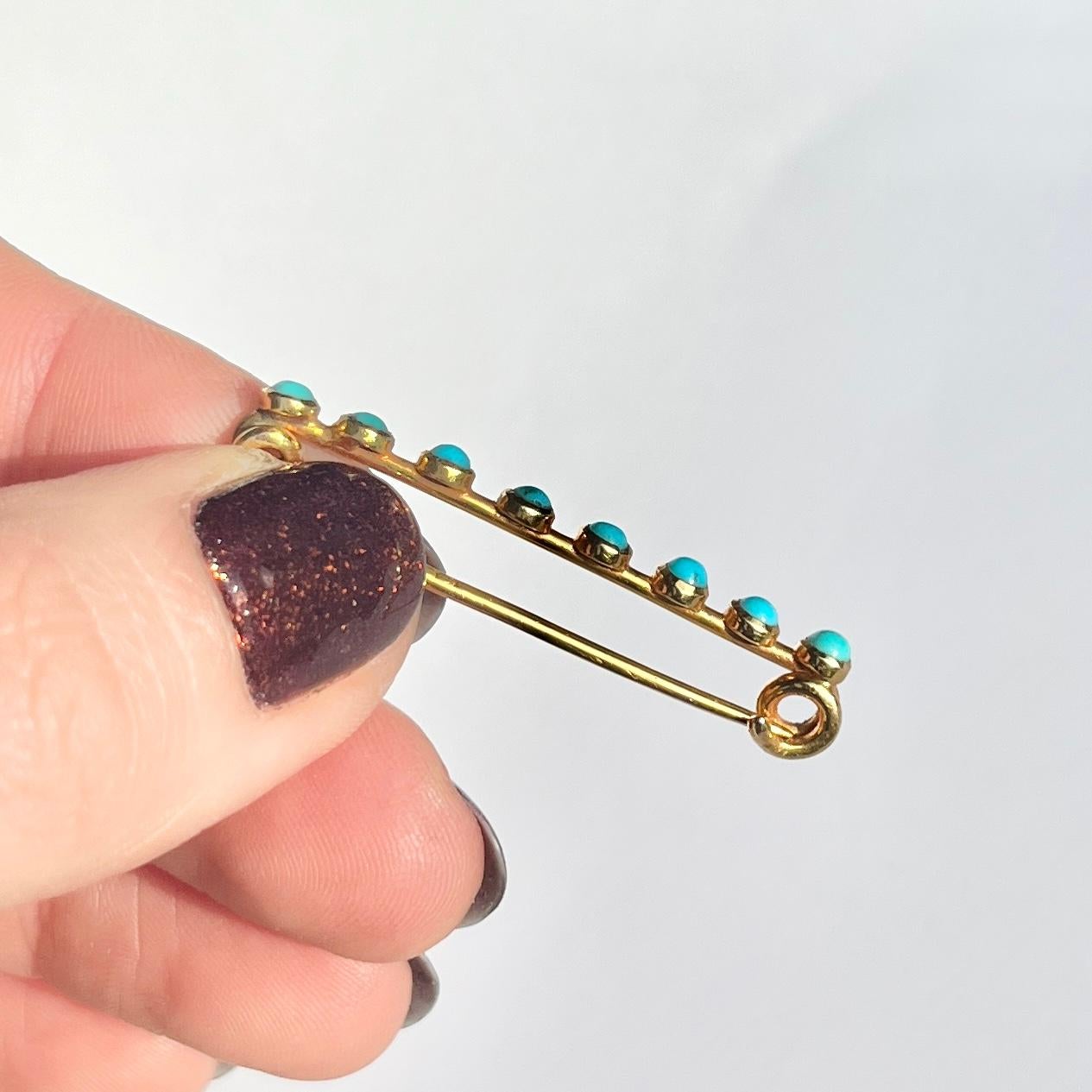 This lovely pin holds 8 bright turquoise stones. The colour of the stones compliment the glossy 15 carat yellow gold perfectly. 

Stone Diameter: 2mm
Pin Length: 39mm

Weight: 2.3g