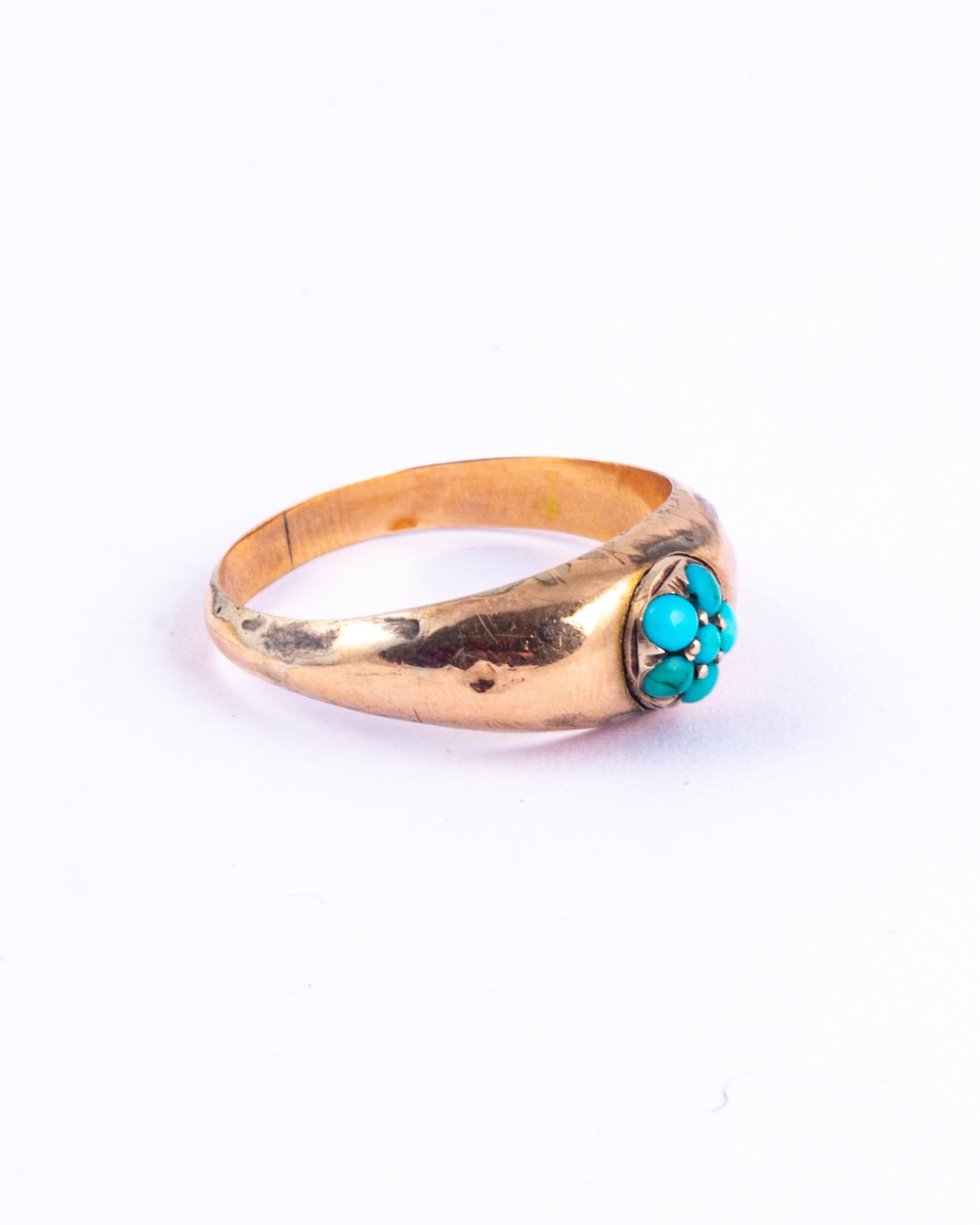 This victorian beauty has six turquoise stones that pop next to the 9ct gold shank. The cluster is perched in a round setting on top of the chunky band. 

Ring Size: N or 6 3/4 
Cluster Diameter: 7.5mm

Weight: 1.48g