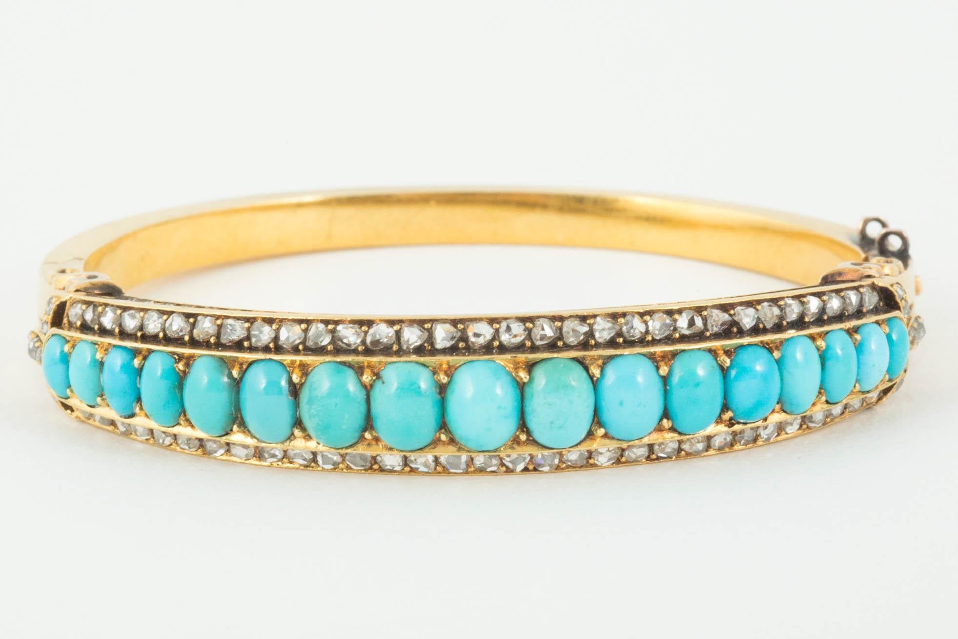 Hinged bangle in 15ct Gold set with graduated oval cabochon cut turquoise flanked by rose cut diamonds