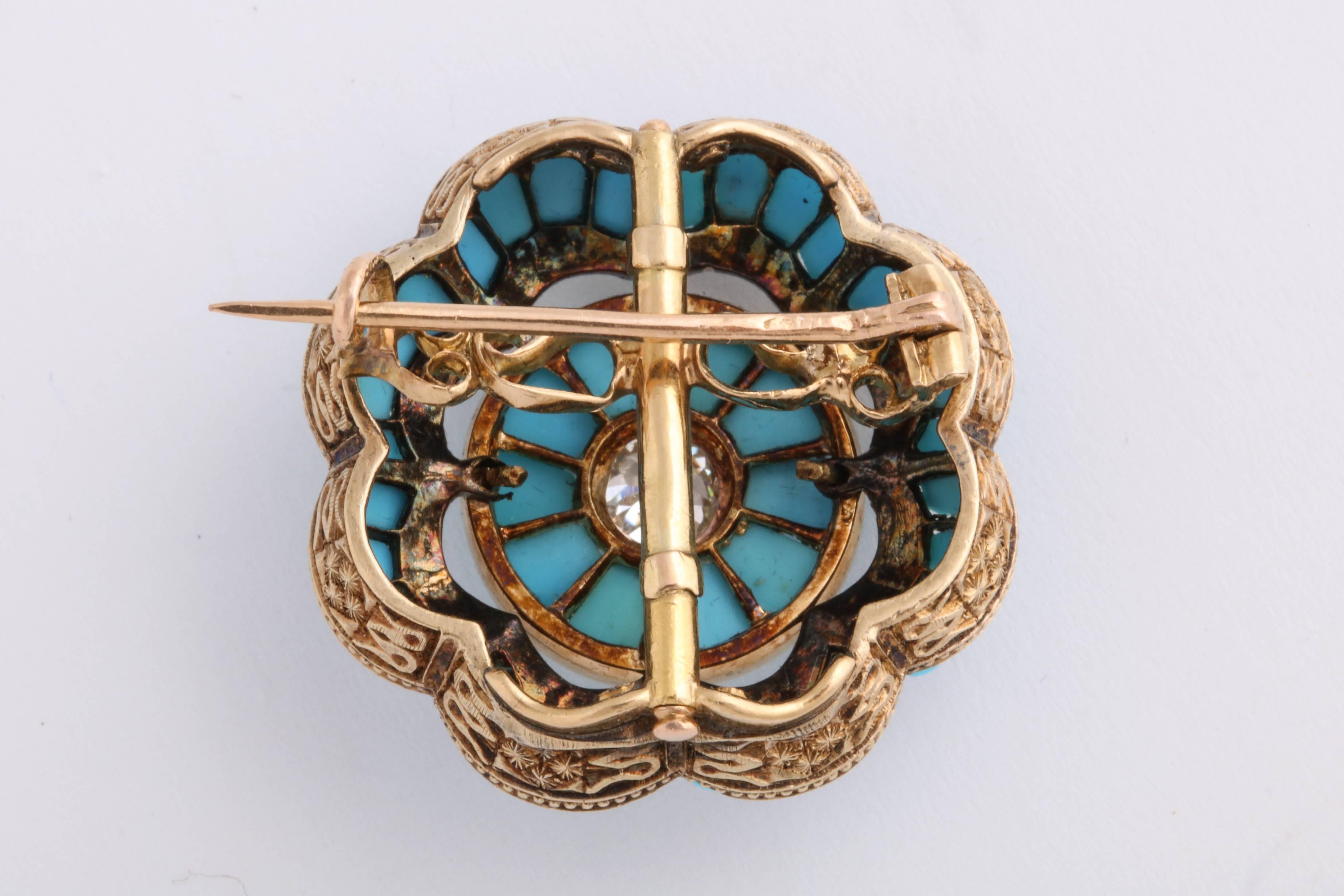 Turquoise and Diamond Brooch set in 18K yellow gold. Center old mine cut diamond is just under .50cts. Beautiful engraving in the scalloped design of the gold. 