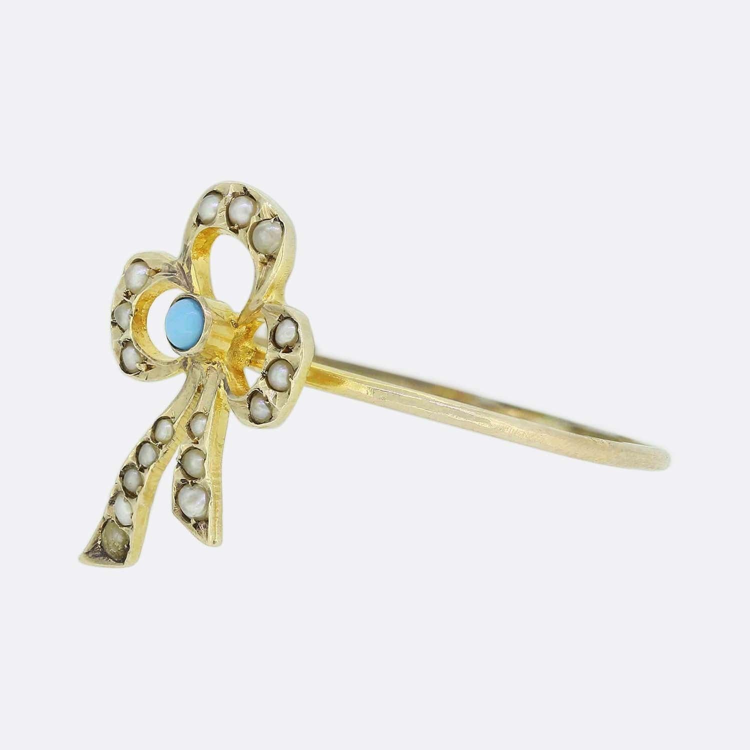 Here we have a charming Victorian turquoise and pearl ring. The head of the ring has been crafted into an open bowed shaped ribbon with a turquoise gemstone set at the centre and an array of seed pearls covering the rest of the motif. 

This piece
