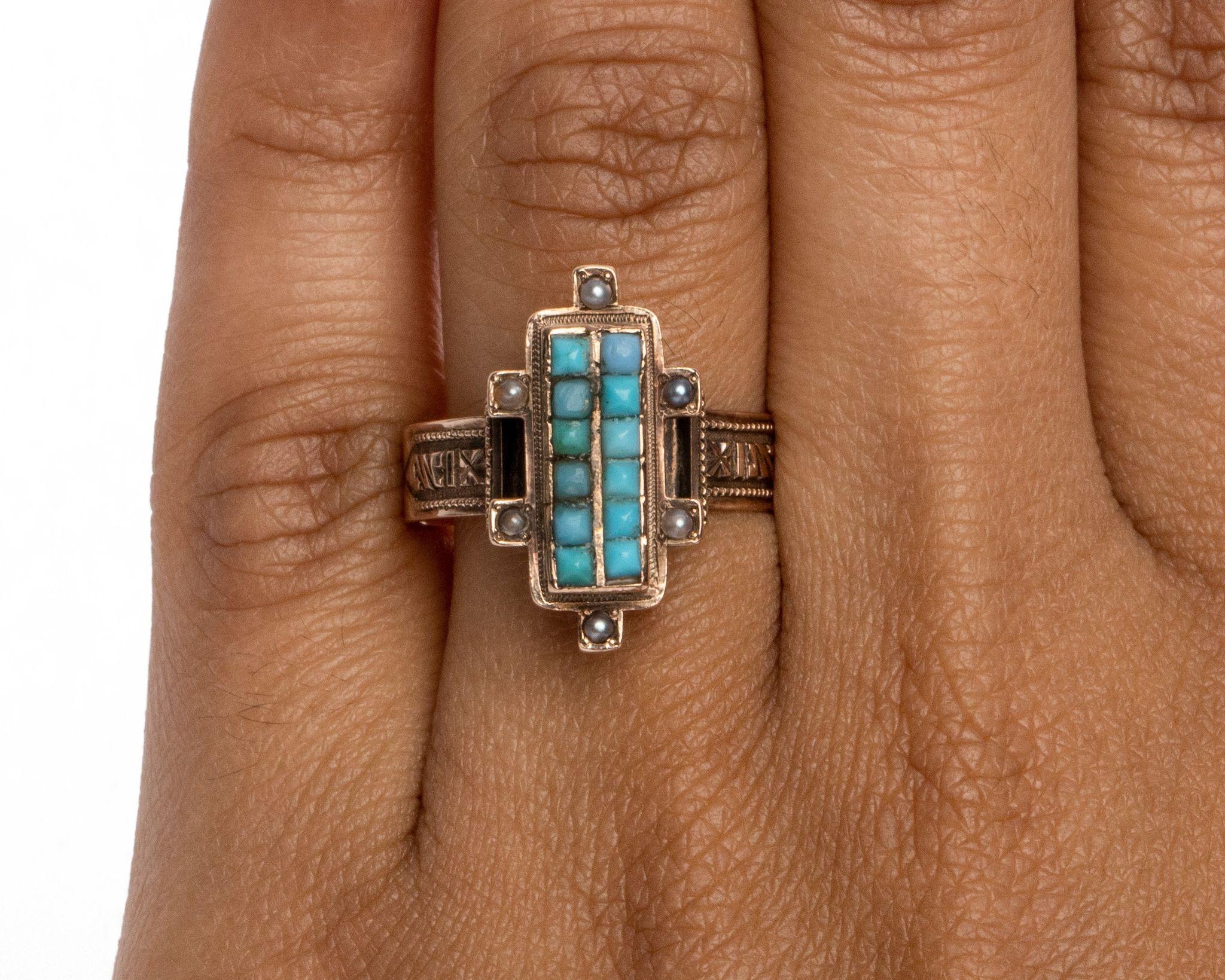 This piece is a genuine, turn of the century, Victorian beauty! An excellent example of a victorian rings featuring an long slender symmetrical design incorporating seed pearls along the sides of a beautiful mosaic of turquoise center.  The bright