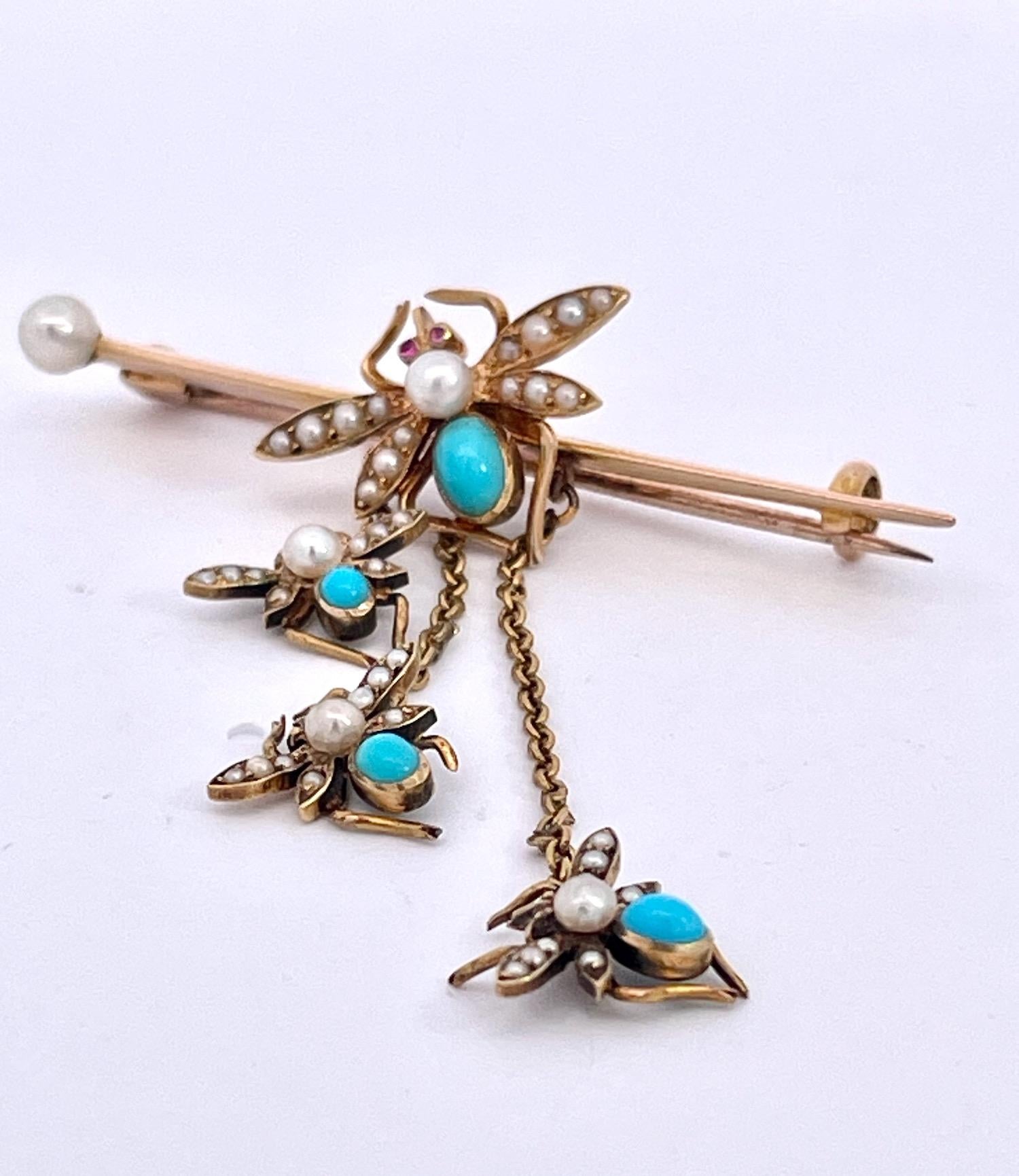 This Victorian Fly brooch is special as it has 3 baby flies hanging from a bar with a Larger fly sitting on the bar.  These are done in 14K yellow Gold and Turquoise.  In addition these flies have seed pearls covering its wings and the large fly
