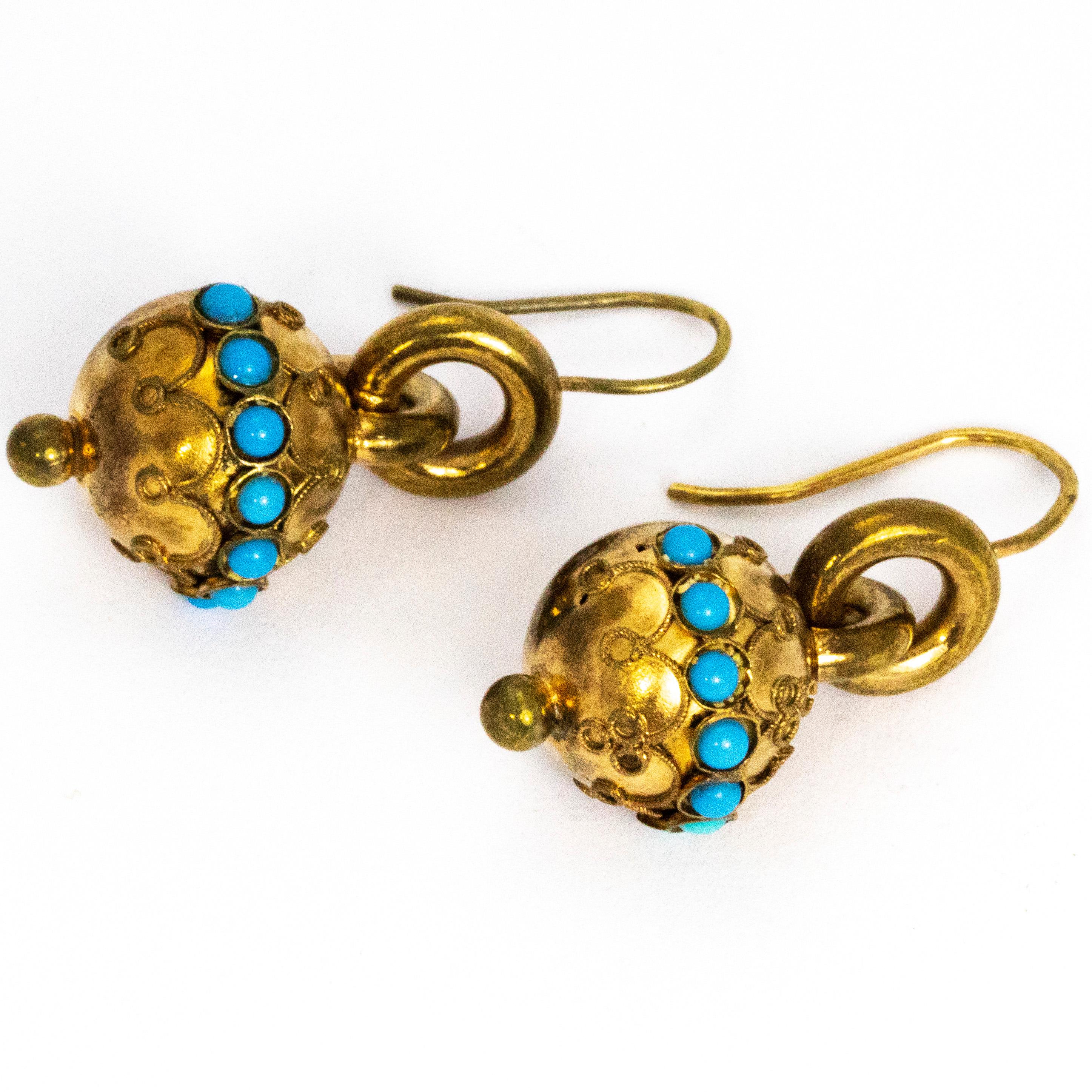 The pop of colour the turquoise stones give to these gorgeous earrings a striking appearance. The orbs which carry the turquoise also have delicate chain like detail and are connected to the shepherds hook by a gorgeous chunky gold hoop.

Drop