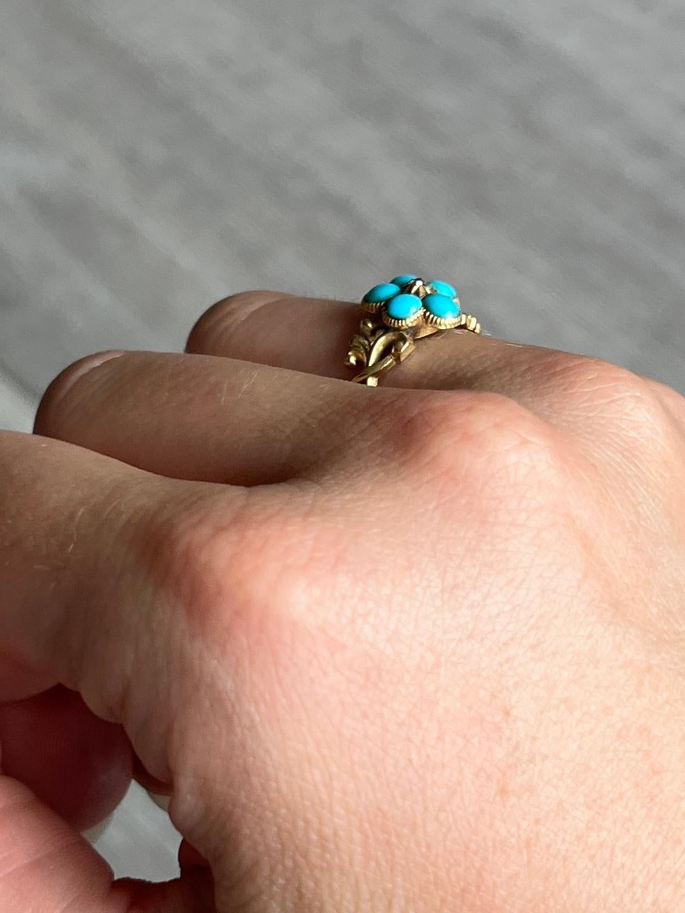 This beauty has an incredibly decorative 9ct gold shank and a locket back on the underside of the cluster. Sat on top of the swirling detail is a cluster of five bright turquoise and a rose cut diamond at the centre. 

Ring Size:  L or 5 3/4