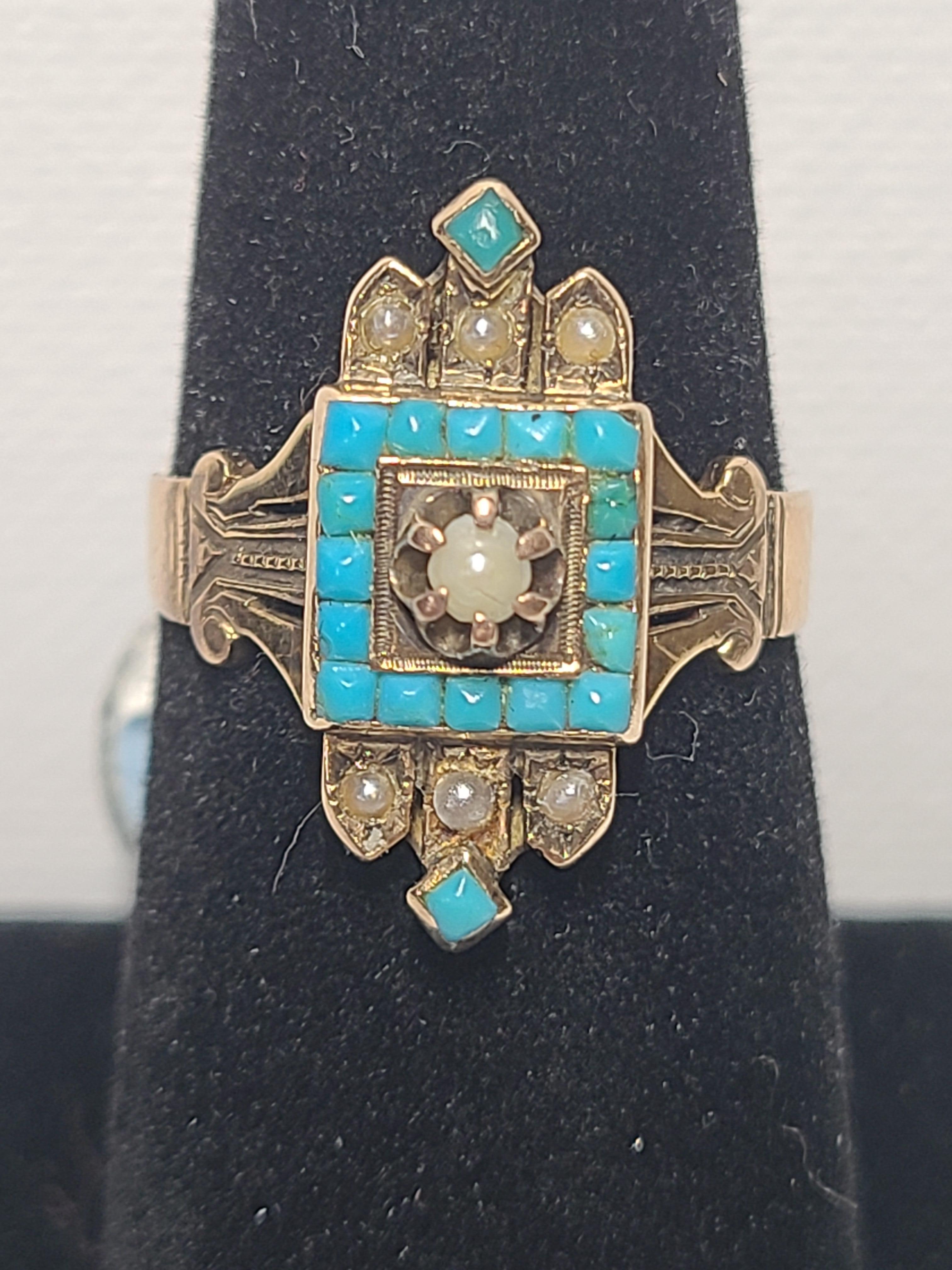 A beautiful example of Victorian era fashion. This 14K yellow gold ring features 18 square cut turquoise stones and 7 seed pearls set in an ornately art carved setting.
The ring is size 8.25 (US) and weighs 4.8 grams.