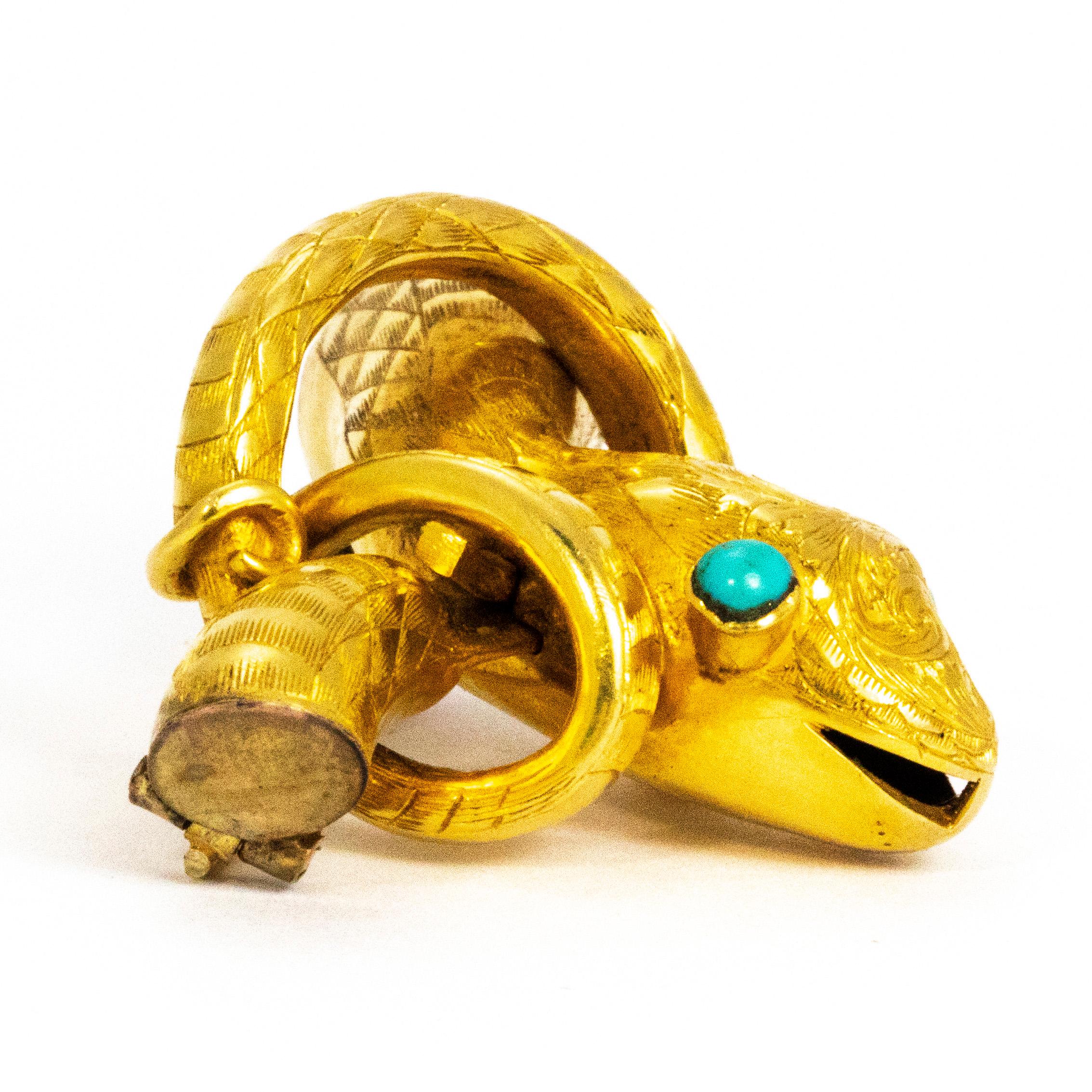 This wonderful snake brooch is so quirky and stylish! The eyes of the snake are set with turquoise and the body is modelled in yellow metal. The body is exquisitely engraved with the finest detail. As you will notice the detail on the face of the