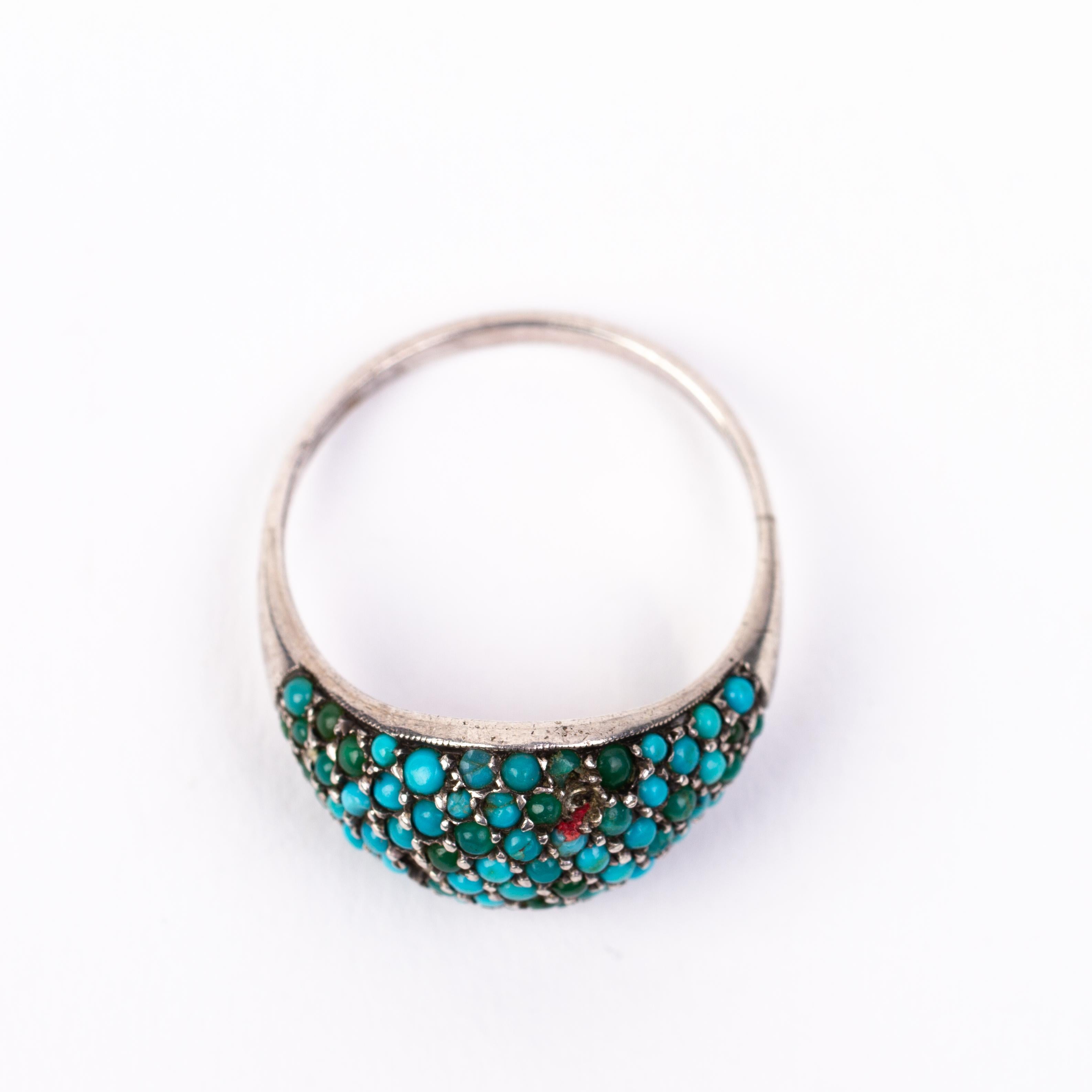 In good condition
From a private collection
Free international shipping
Missing two small turquoise beads
Turquoise Cluster Silver Ring